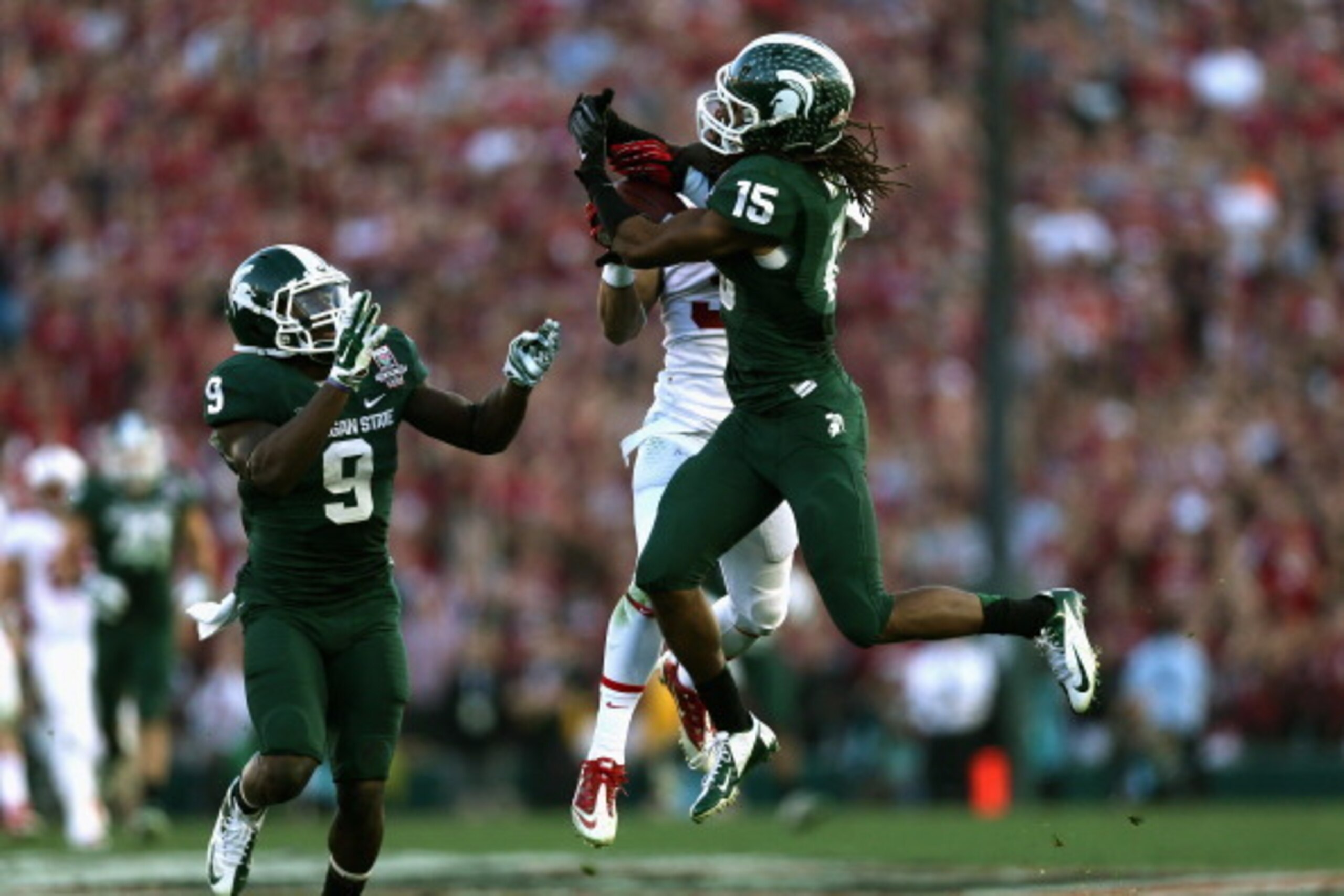 PASADENA, CA - JANUARY 01:  Cornerback Trae Waynes #15 of the Michigan State Spartans makes an interception against the Stanford Cardinal in the third quarter of the 100th Rose Bowl Game presented by Vizio at the Rose Bowl on January 1, 2014 in Pasadena, 