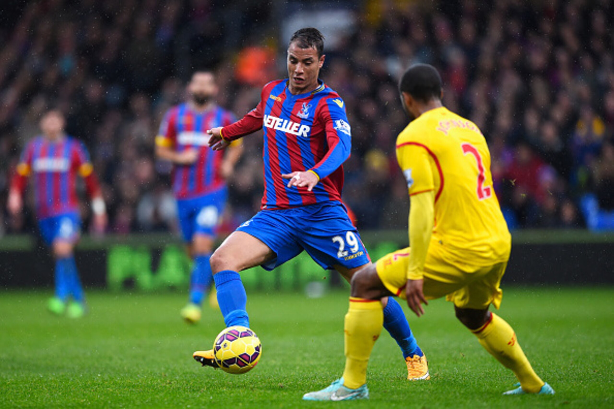 LONDON, ENGLAND - NOVEMBER 23: Marouane Chamakh of Crystal Palace is closed down by Glen Johnson of Liverpool during the Barclays Premier League match between Crystal Palace and Liverpool at Selhurst Park on November 23, 2014 in London, England.  (Photo b