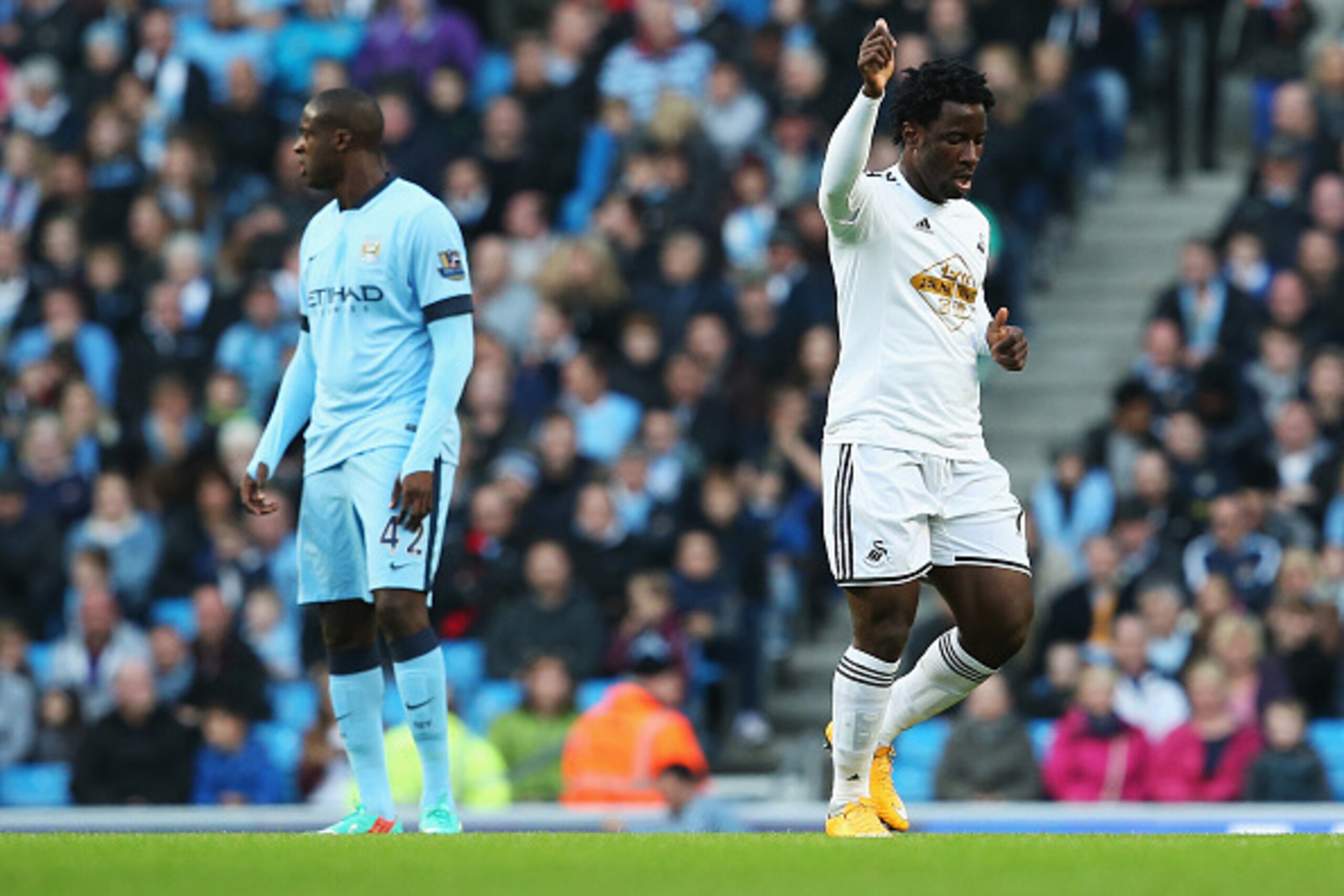 MANCHESTER, ENGLAND - NOVEMBER 22:  Wilfried Bony of Swansea City celebrates his opening goal during the Barclays Premier League match between Manchester City and Swansea City at Etihad Stadium on November 22, 2014 in Manchester, England.  (Photo by Jan K