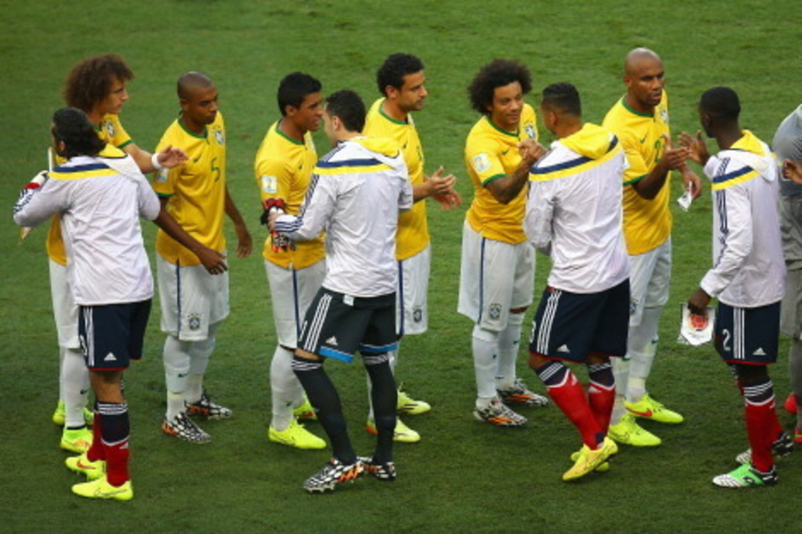 FORTALEZA, BRAZIL - JULY 04: Brazil and Colombia players shake hands prior to the 2014 FIFA World Cup Brazil Quarter Final match between Brazil and Colombia at Castelao on July 4, 2014 in Fortaleza, Brazil.  (Photo by Michael Steele/Getty Images)