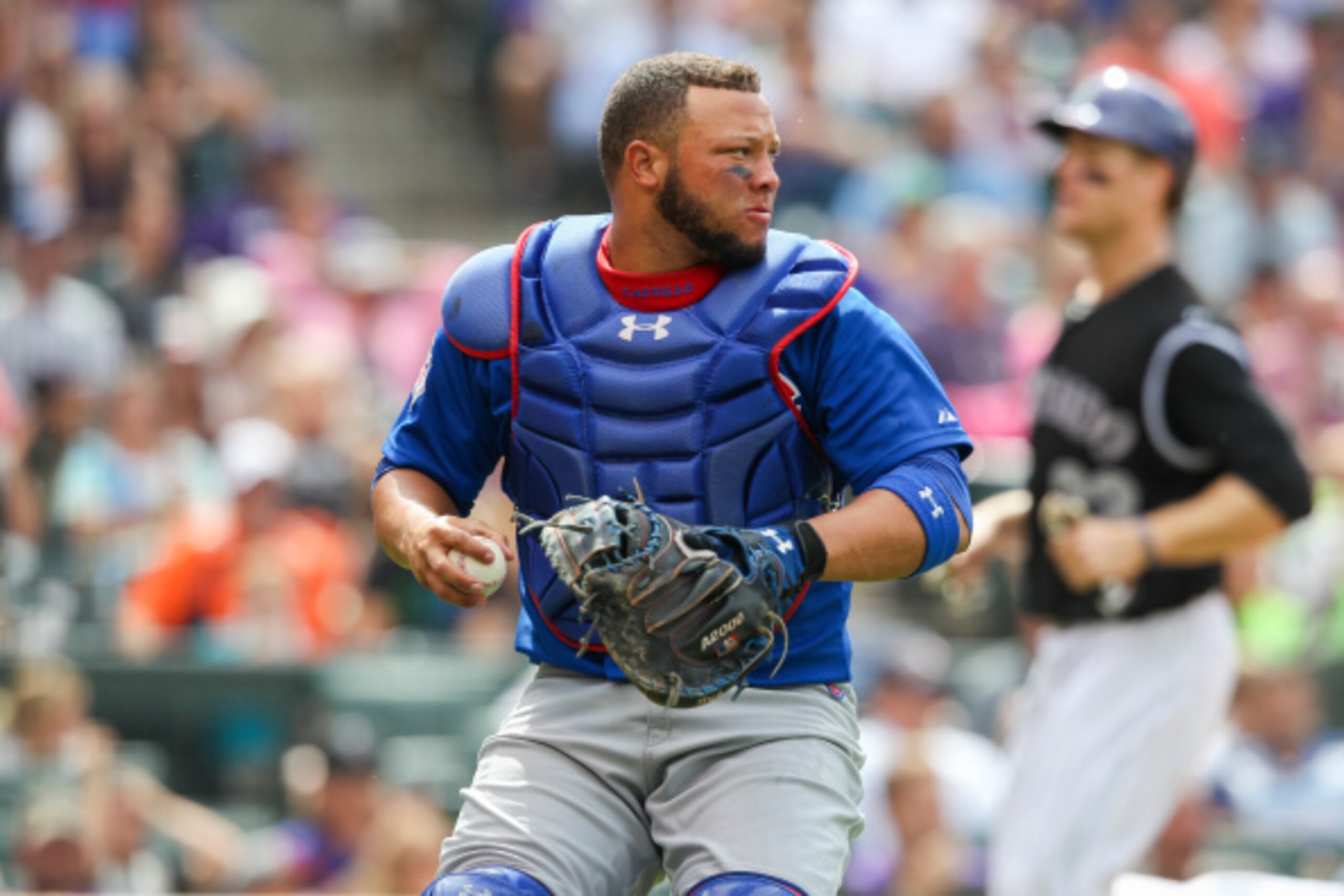 DENVER, CO - AUGUST 07:  Chicago Cubs catcher Wellington Castillo #5 looks to throw to second base against the Colorado Rockies at Coors Field on August 7, 2014 in Denver, Colorado. The Chicago Cubs defeated the Colorado Rockies 6-2. (Photo by Trevor Brow
