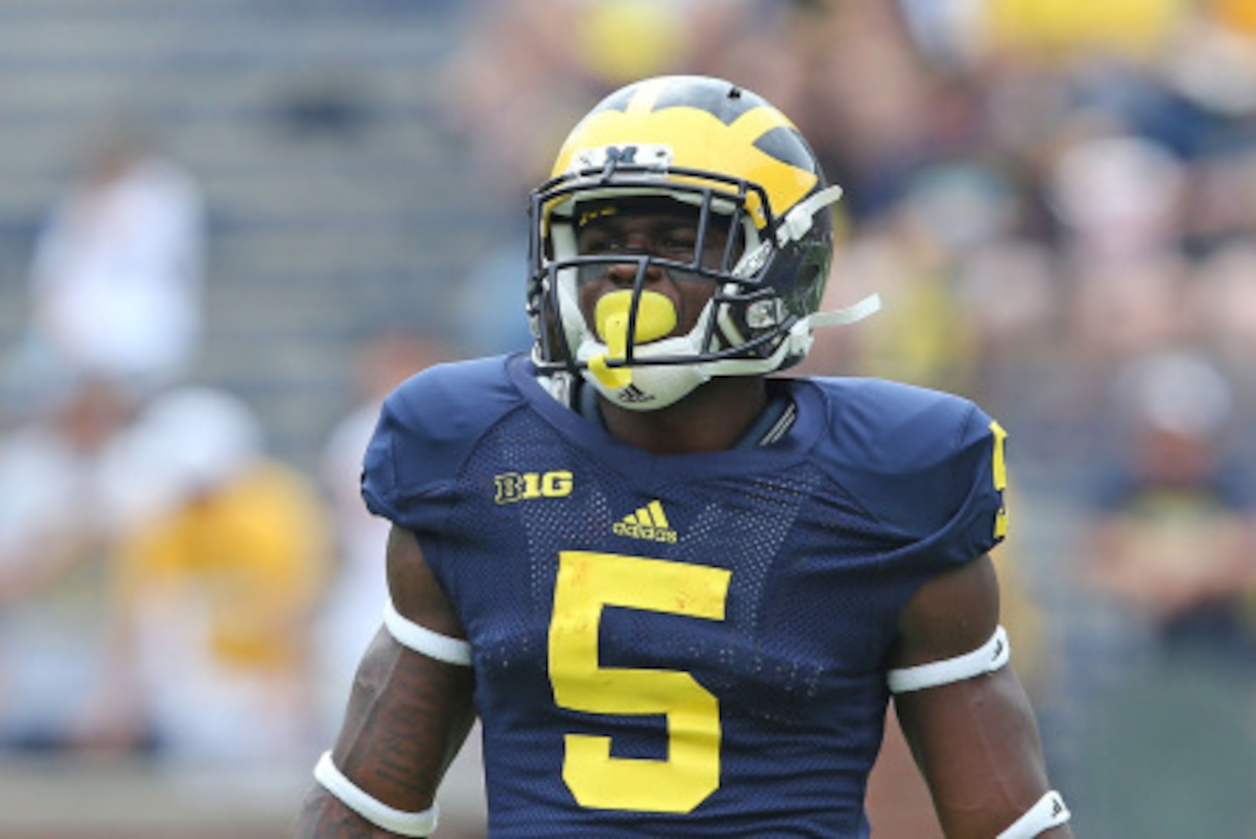 ANN ARBOR, MI - AUGUST 30:  Jabrill Peppers #5 of the Michigan Wolverines warms up prior to the start of the game against the Appalachian State Mountaineers on August 30, 2014 in Ann Arbor, Michigan. The Wolverines defeated the Mountaineers 52-14.  (Photo