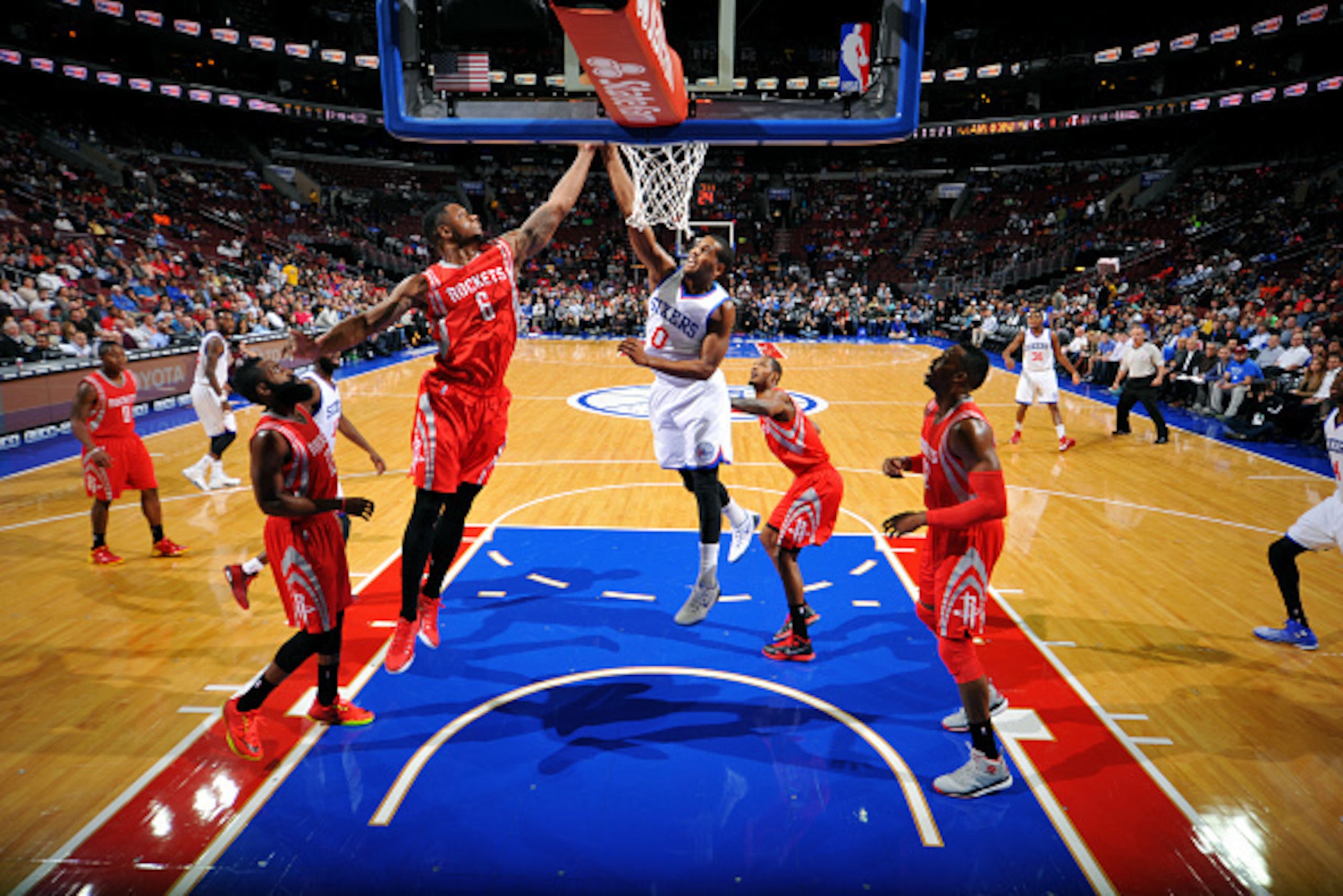 PHILADELPHIA, PA - NOVEMBER 3: Terrence Jones #6 of the Houston Rockets grabs a rebound against Brandon Davies #0 of the Philadelphia 76ers on November 3, 2014 at the Wells Fargo Center in Philadelphia, Pennsylvania. NOTE TO USER: User expressly acknowled