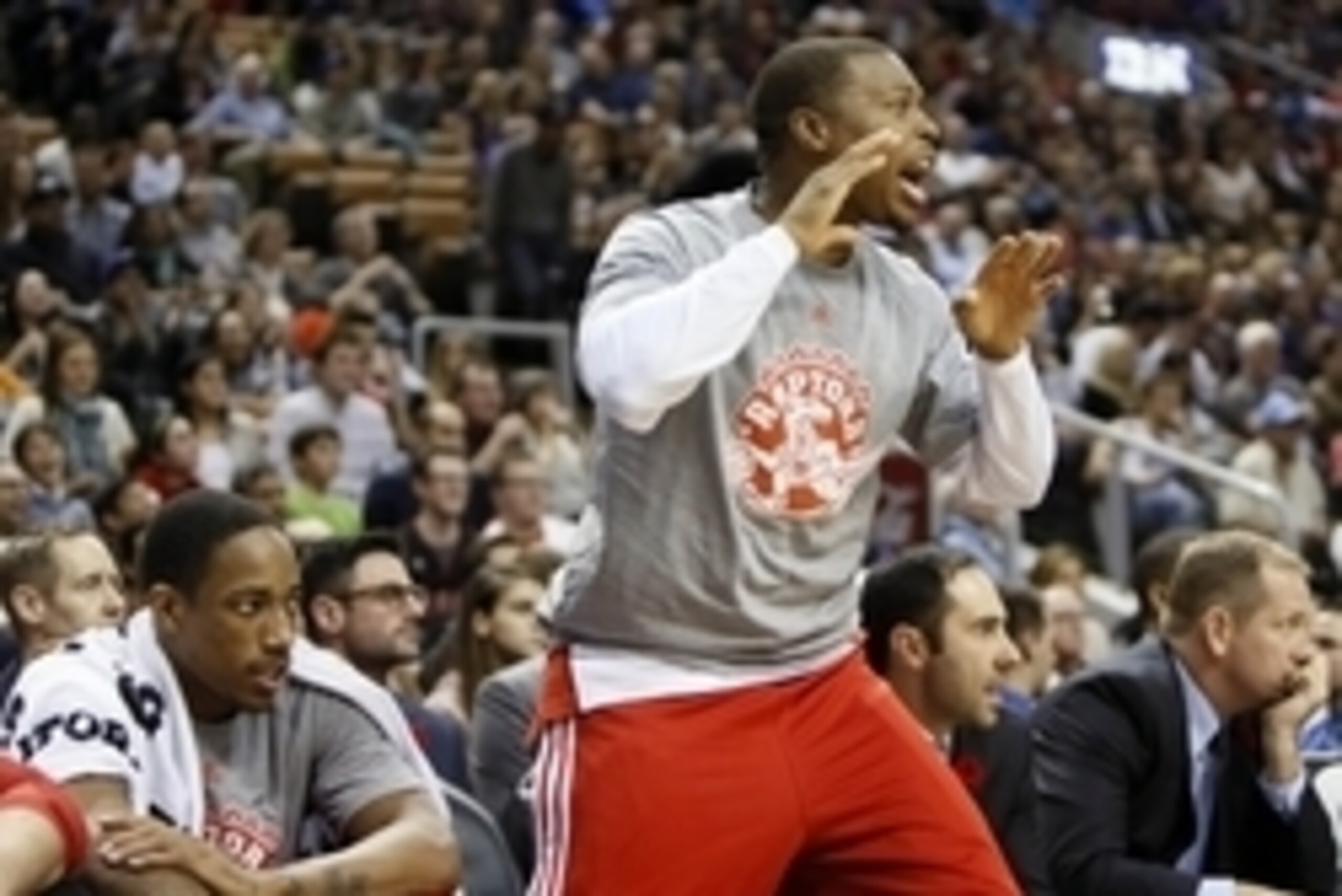 Nov 9, 2014; Toronto, Ontario, CAN; Toronto Raptors guard Kyle Lowry (7) yells from the bench as Toronto Raptors guard DeMar DeRozan (10) looks on against Philadelphia 76ers at the Air Canada Centre. Toronto defeated Philadelphia 120-88. Mandatory Credit: