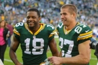 Sep 14, 2014; Green Bay, WI, USA; Green Bay Packers wide receiver Randall Cobb (18) and wide receiver Jordy Nelson (87) celebrate after the game against the New York Jets at Lambeau Field. Green Bay won 31-24. Mandatory Credit: Dennis Wierzbicki-USA TODAY