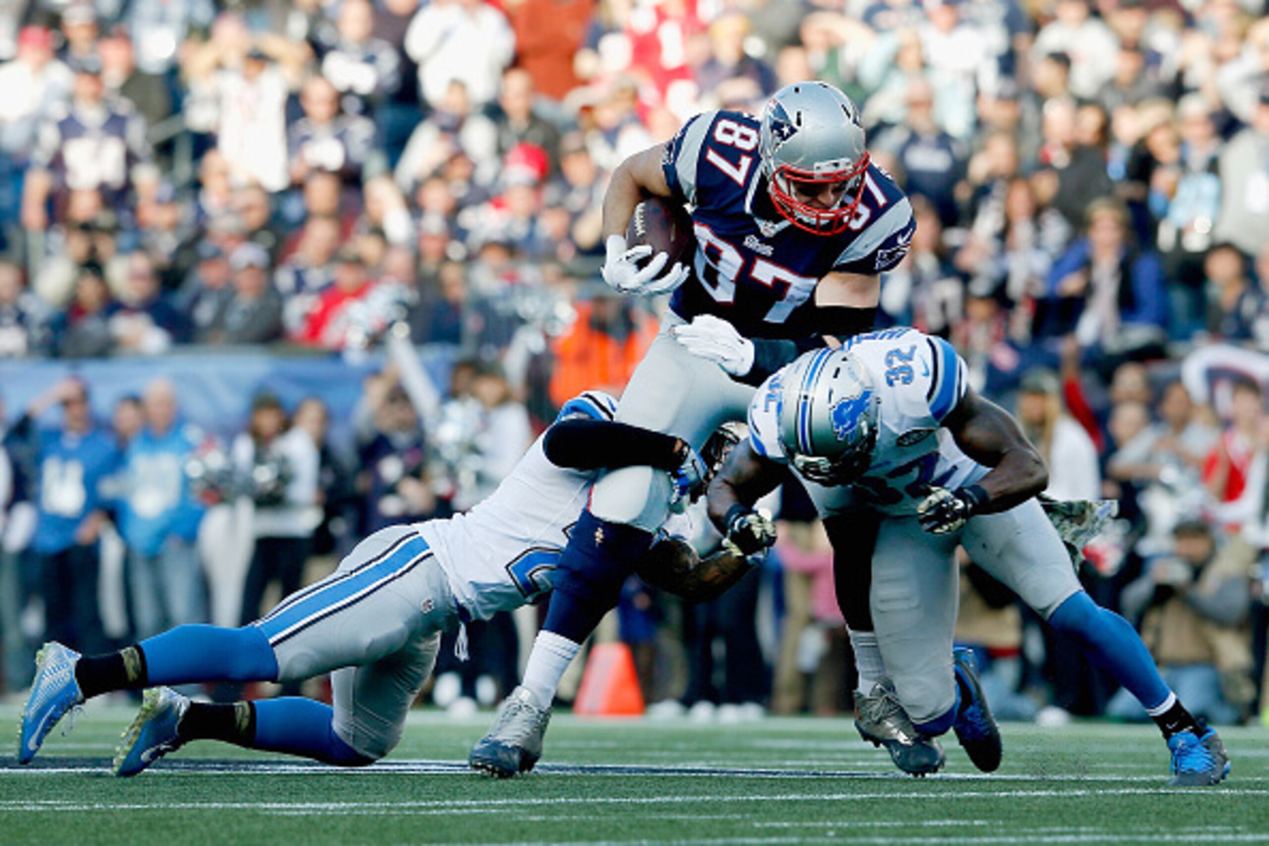 FOXBORO, MA - NOVEMBER 23:  Rob Gronkowski #87 of the New England Patriots carries the ball during the second quarter against the Detroit Lions at Gillette Stadium on November 23, 2014 in Foxboro, Massachusetts.  (Photo by Jim Rogash/Getty Images)