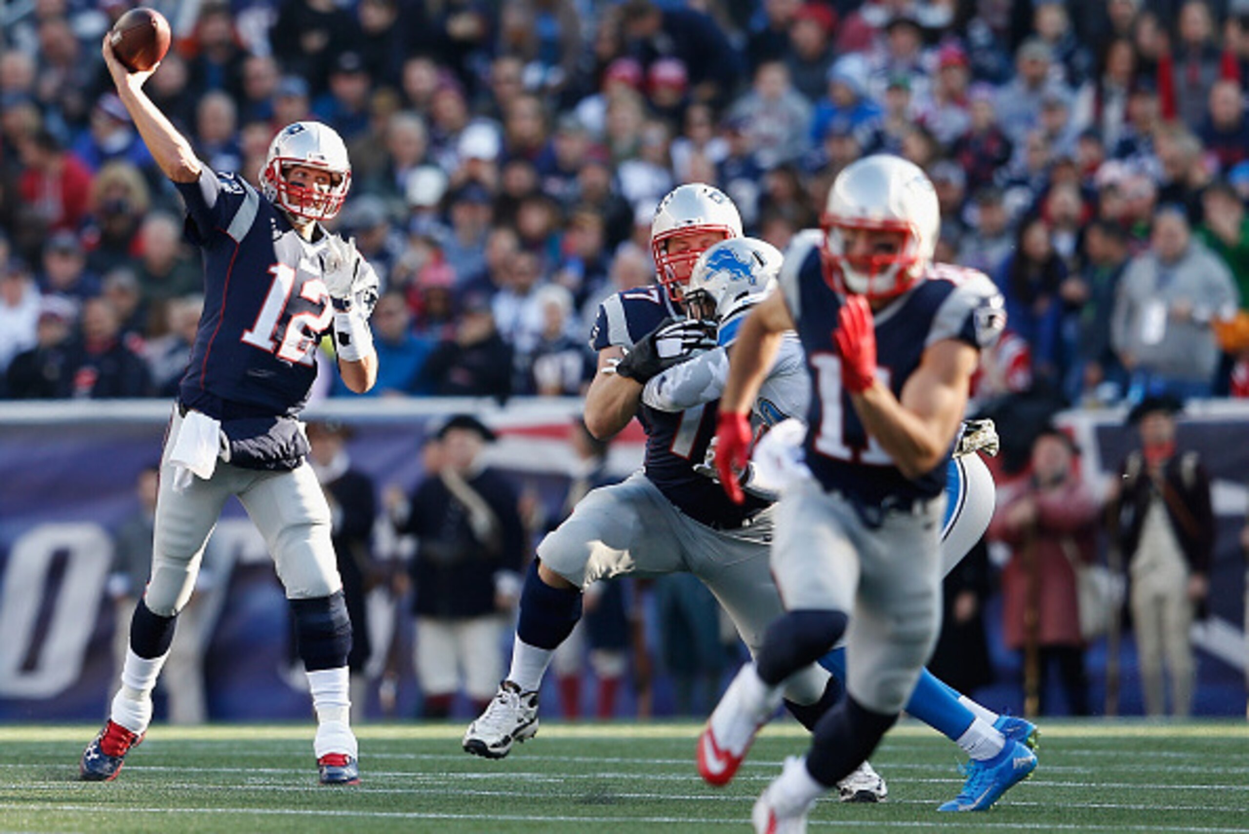FOXBORO, MA - NOVEMBER 23:  Tom Brady #12 of the New England Patriots passes the ball during the first quarter against the Detroit Lions at Gillette Stadium on November 23, 2014 in Foxboro, Massachusetts.  (Photo by Jim Rogash/Getty Images)