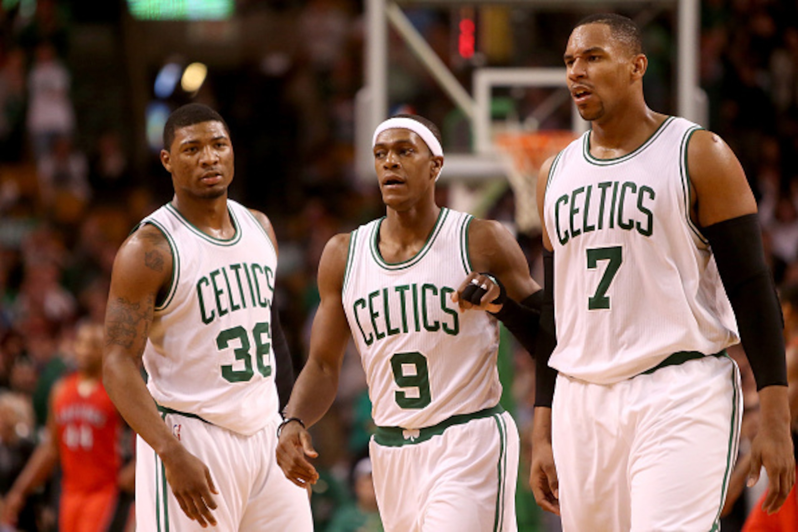 BOSTON, MA - NOVEMBER 05: Marcus Smart #36, Rajon Rondo #9 and Jared Sullinger #7 of the Boston Celtics look on after a play against the Toronto Raptors at TD Garden on November 5, 2014 in Boston, Massachusetts. NOTE TO USER: User expressly acknowledges a