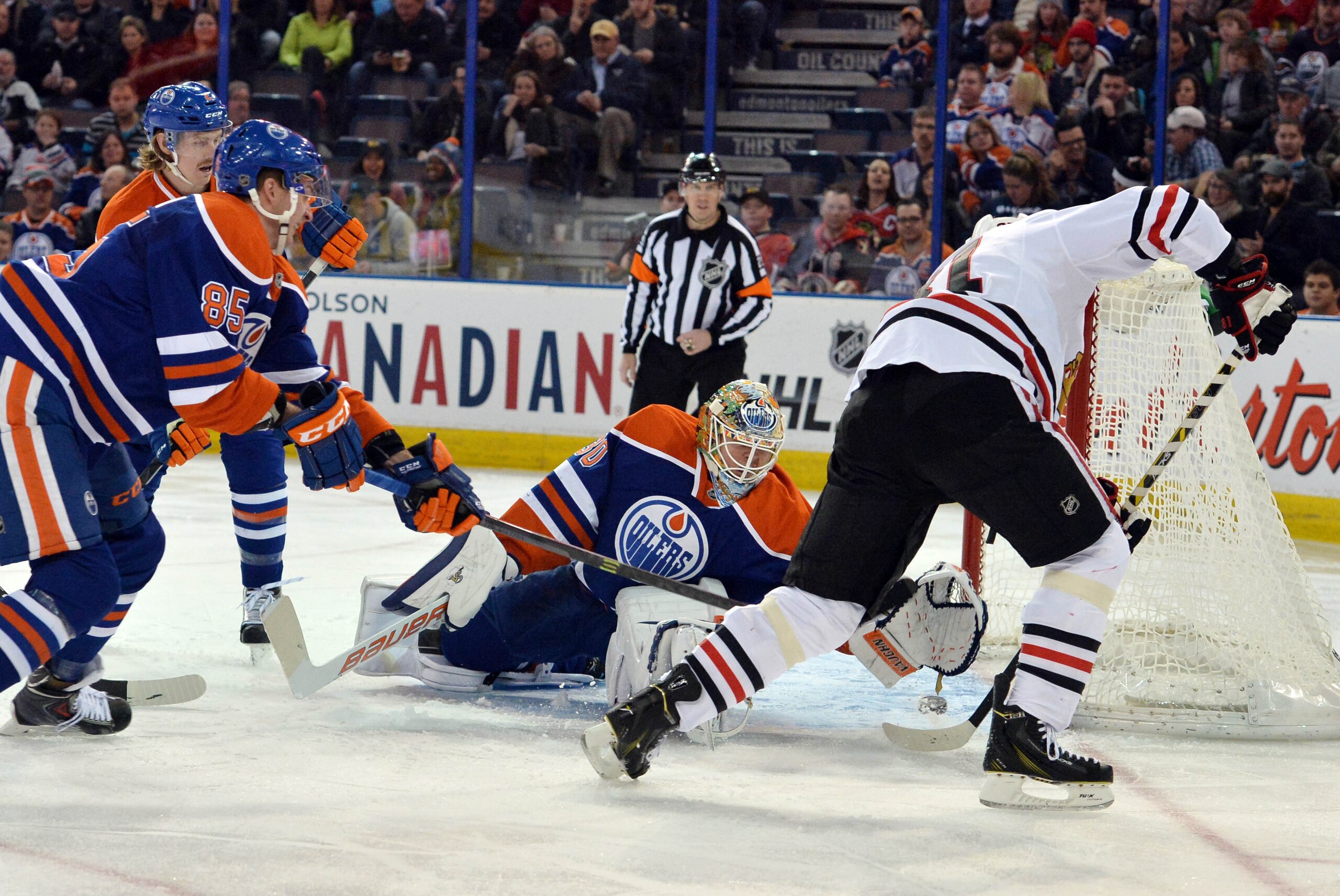 Nov 22, 2014; Edmonton, Alberta, CAN; Chicago Blackhawks right Wing Marian Hossa (81) scores a goal on Edmonton Oilers goalie Ben Scrivens (30) in the second period at Rexall Place. Mandatory Credit: Chris LaFrance-USA TODAY Sports