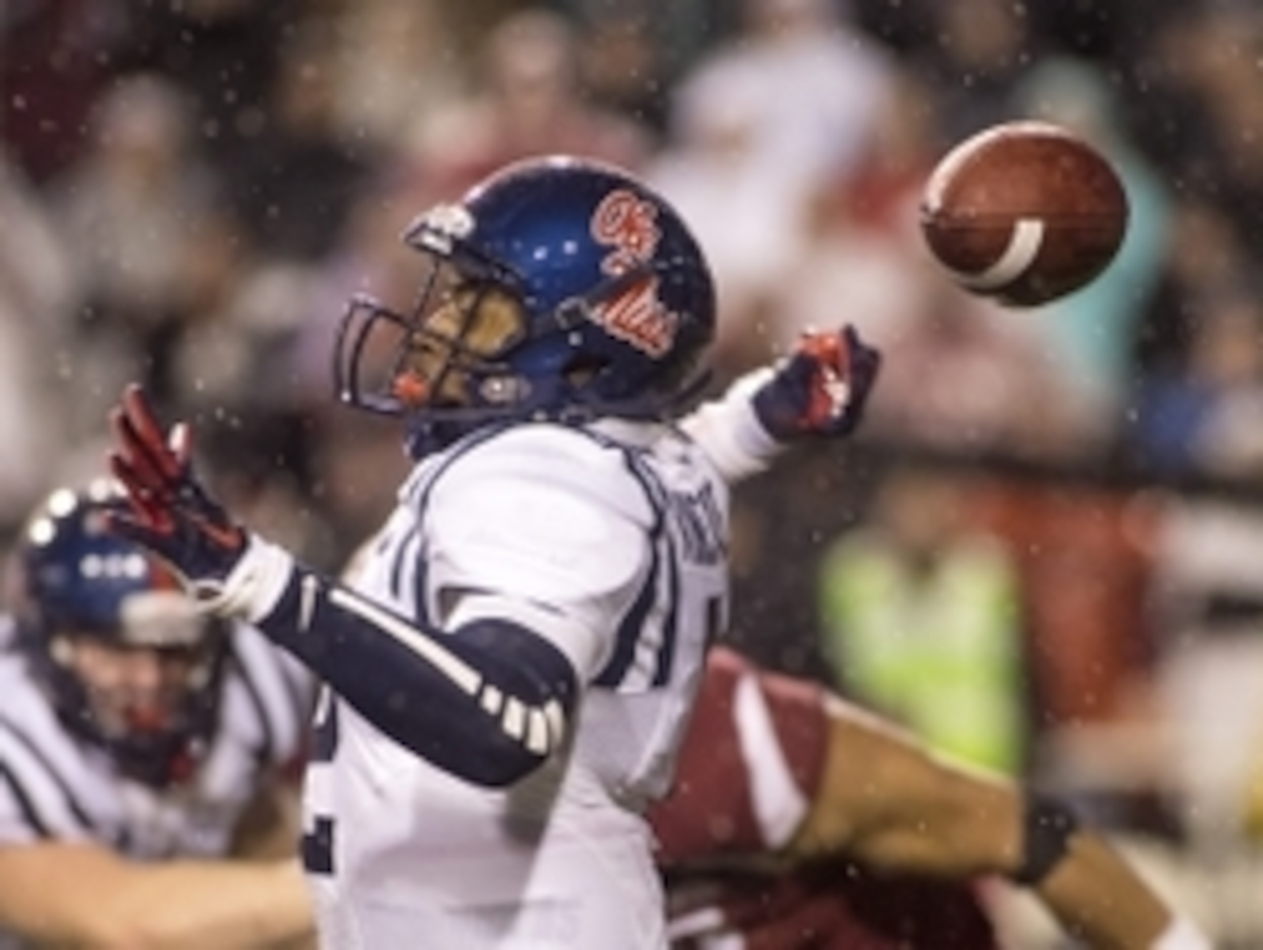 Nov 22, 2014; Fayetteville, AR, USA; Ole Miss Rebels quarterback DeVante Kincade (2) fumbles the ball during the second half against the Arkansas Razorbacks at Donald W. Reynolds Razorback Stadium. The Razorbacks won 30-0. Mandatory Credit: Beth Hall-USA 