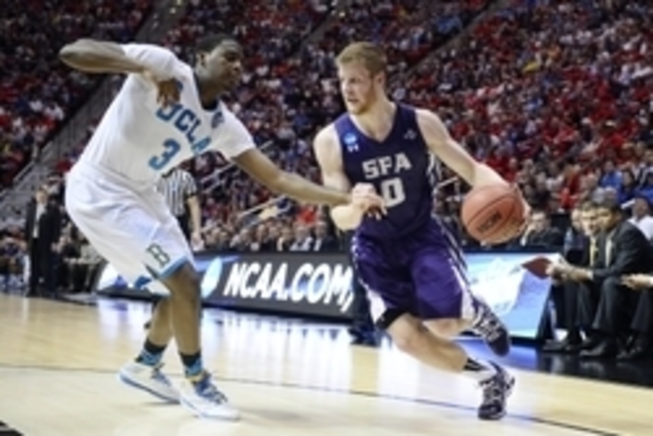 Mar 23, 2014; San Diego, CA, USA; Stephen F. Austin Lumberjacks guard Thomas Walkup (0) drives to the basket past UCLA Bruins guard Jordan Adams (3) in the first half of a men's college basketball game during the third round of the 2014 NCAA Tournament at