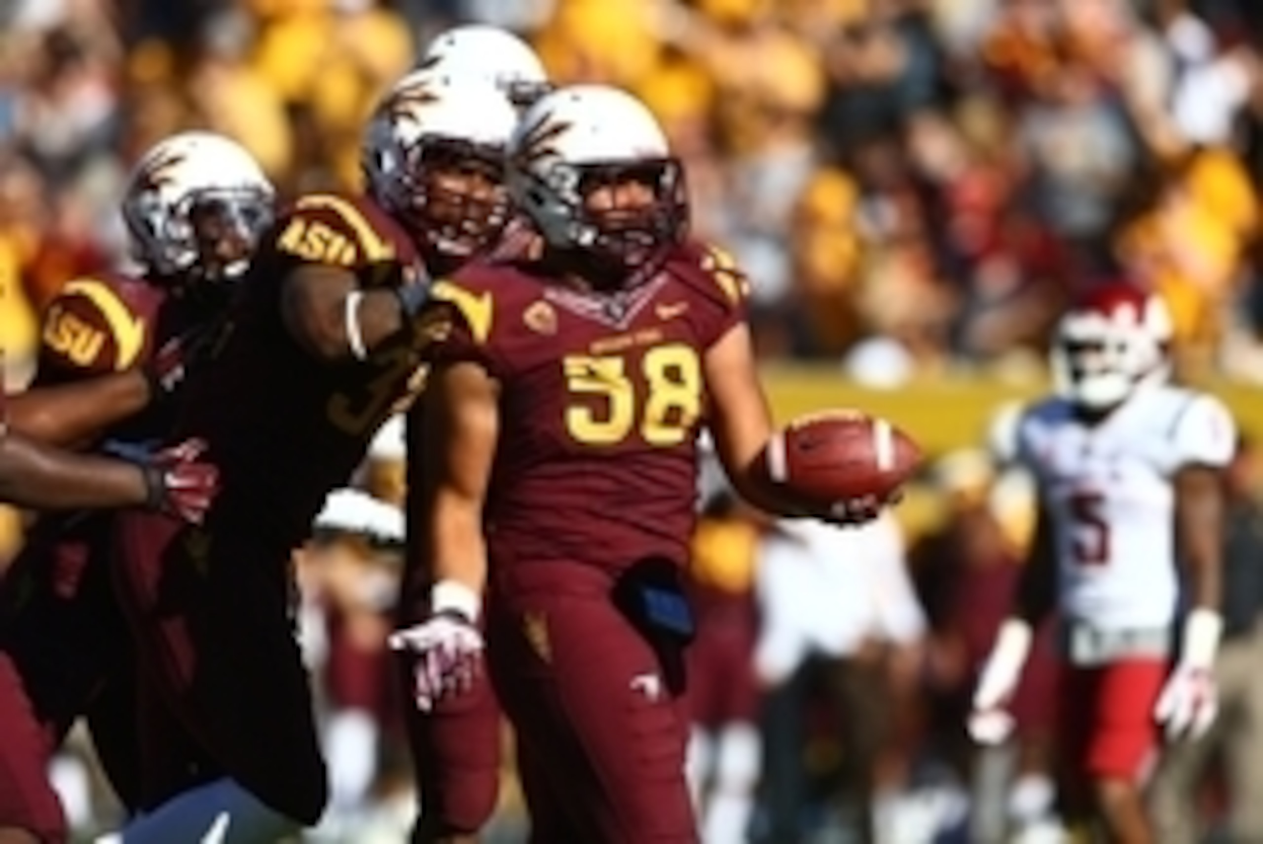 Nov 22, 2014; Tempe, AZ, USA; Arizona State Sun Devils linebacker Salamo Fiso (58) celebrates a fourth quarter interception against the Washington State Cougars at Sun Devil Stadium. The Sun Devils defeats the Cougars 52-31. Mandatory Credit: Mark J. Rebi