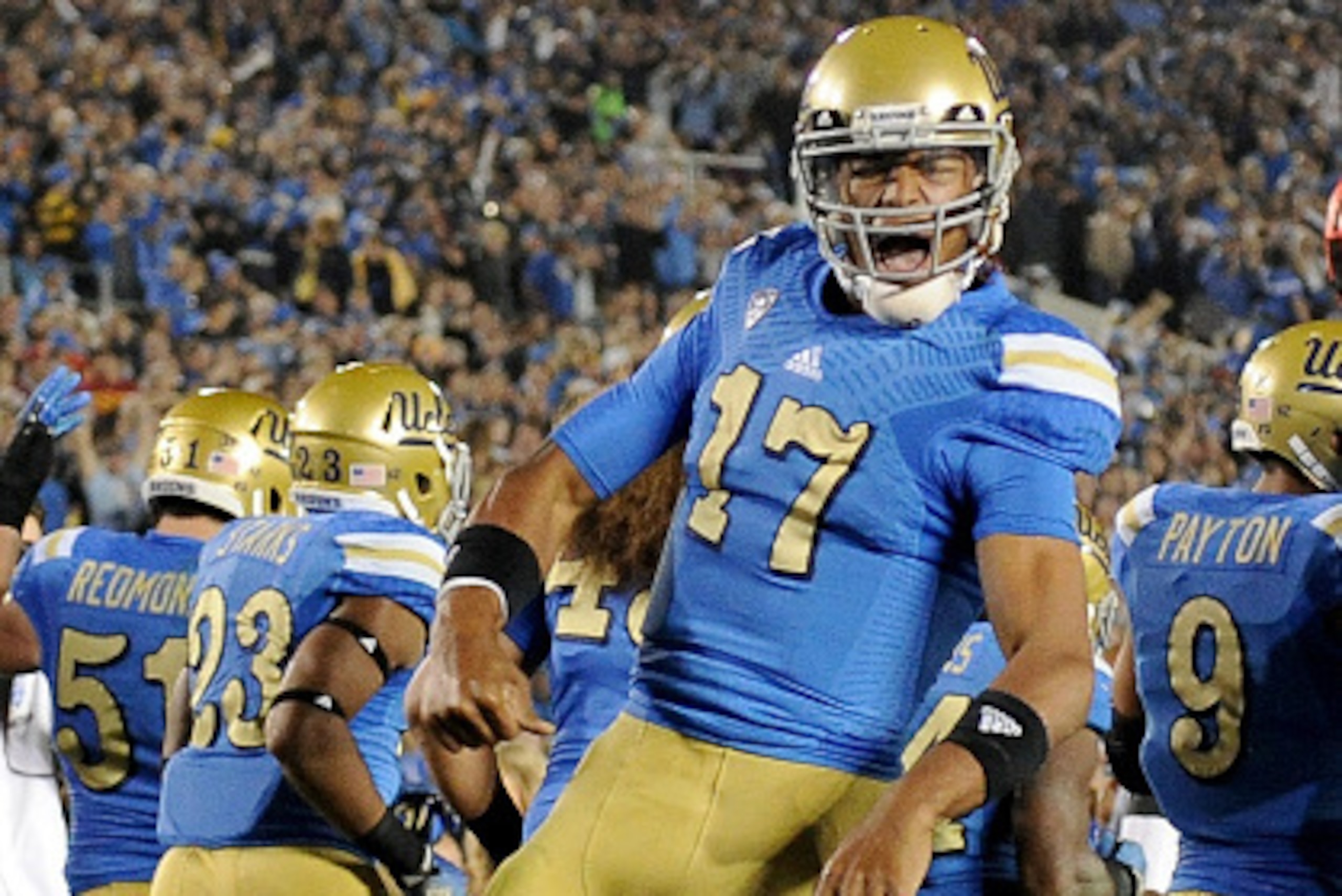 PASADENA, CA - NOVEMBER 22:  Brett Hundley #17 of the UCLA Bruins celebrates his run for a touchdown for a 38-14 lead over the USC Trojans during the third quarter at the Rose Bowl on November 22, 2014 in Pasadena, California. UCLA won 38-14.  (Photo by H