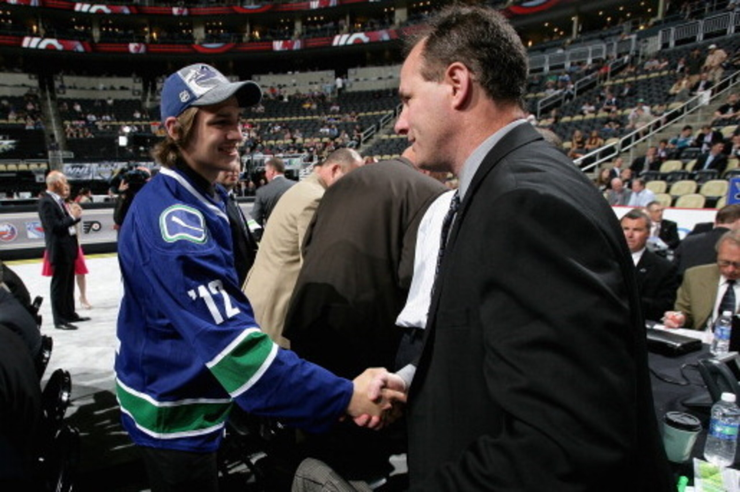 PITTSBURGH, PA - JUNE 23:  Alexandre Mallet, drafted 57th overall by the Vancouver Canucks is greeted by the team during day two of the 2012 NHL Entry Draft at Consol Energy Center on June 23, 2012 in Pittsburgh, Pennsylvania.  (Photo by Dave Sandford/NHL