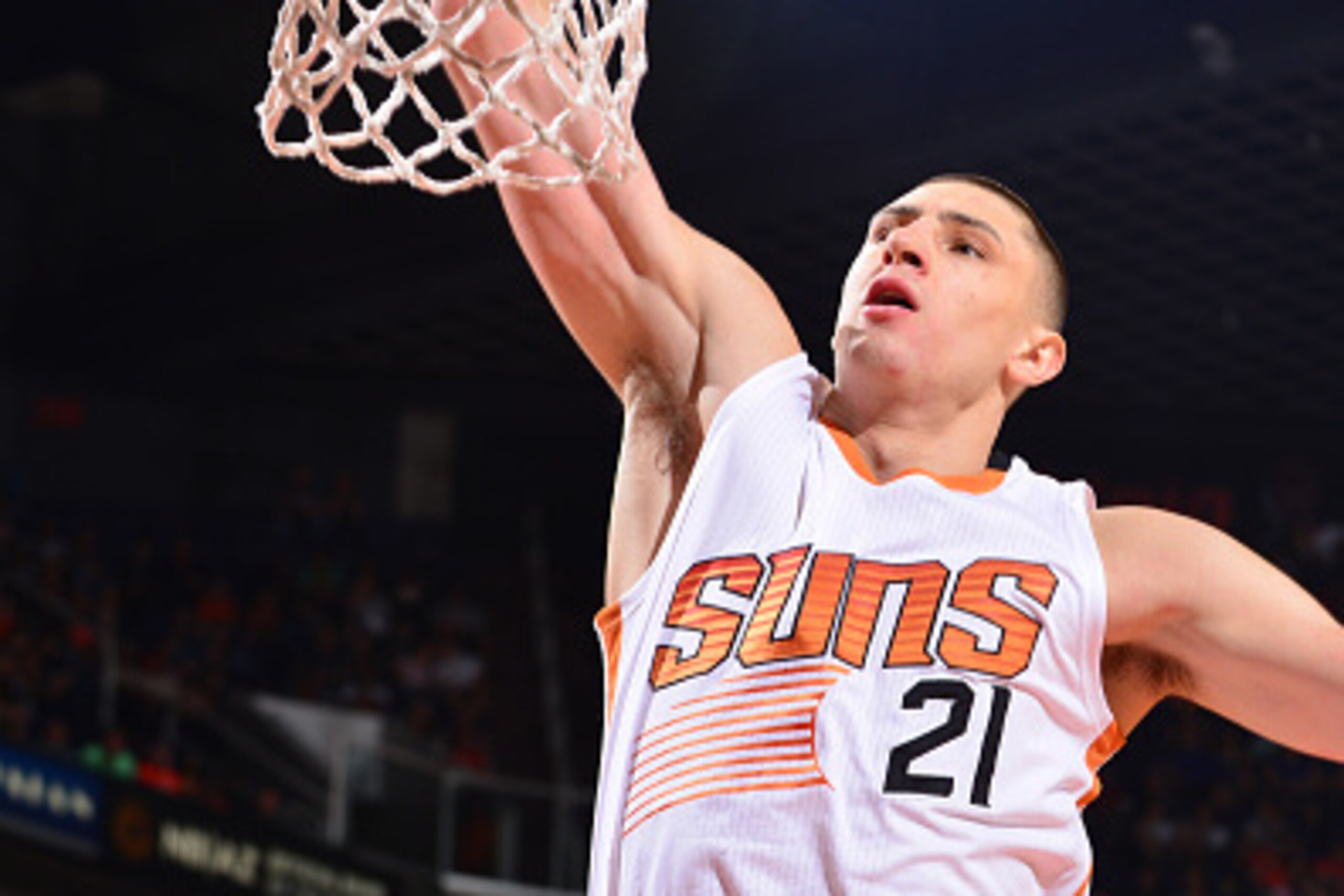PHOENIX, AZ - NOVEMBER 9: Alex Len #21 of the Phoenix Suns dunks against the Golden State Warriors on November 9, 2014 at U.S. Airways Center in Phoenix, Arizona. NOTE TO USER: User expressly acknowledges and agrees that, by downloading and or using this 