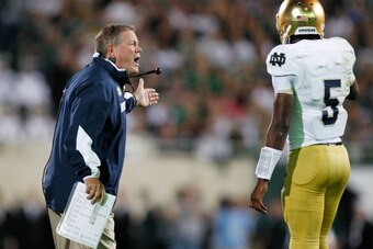 EAST LANSING, MI - SEPTEMBER 15:  Head coach Brian Kelly of the Notre Dame Fighting Irish talks to quarterback Everett Golson #5 while playing the Michigan State Spartans at Spartan Stadium Stadium on September 15, 2012 in East Lansing, Michigan. Notre Da