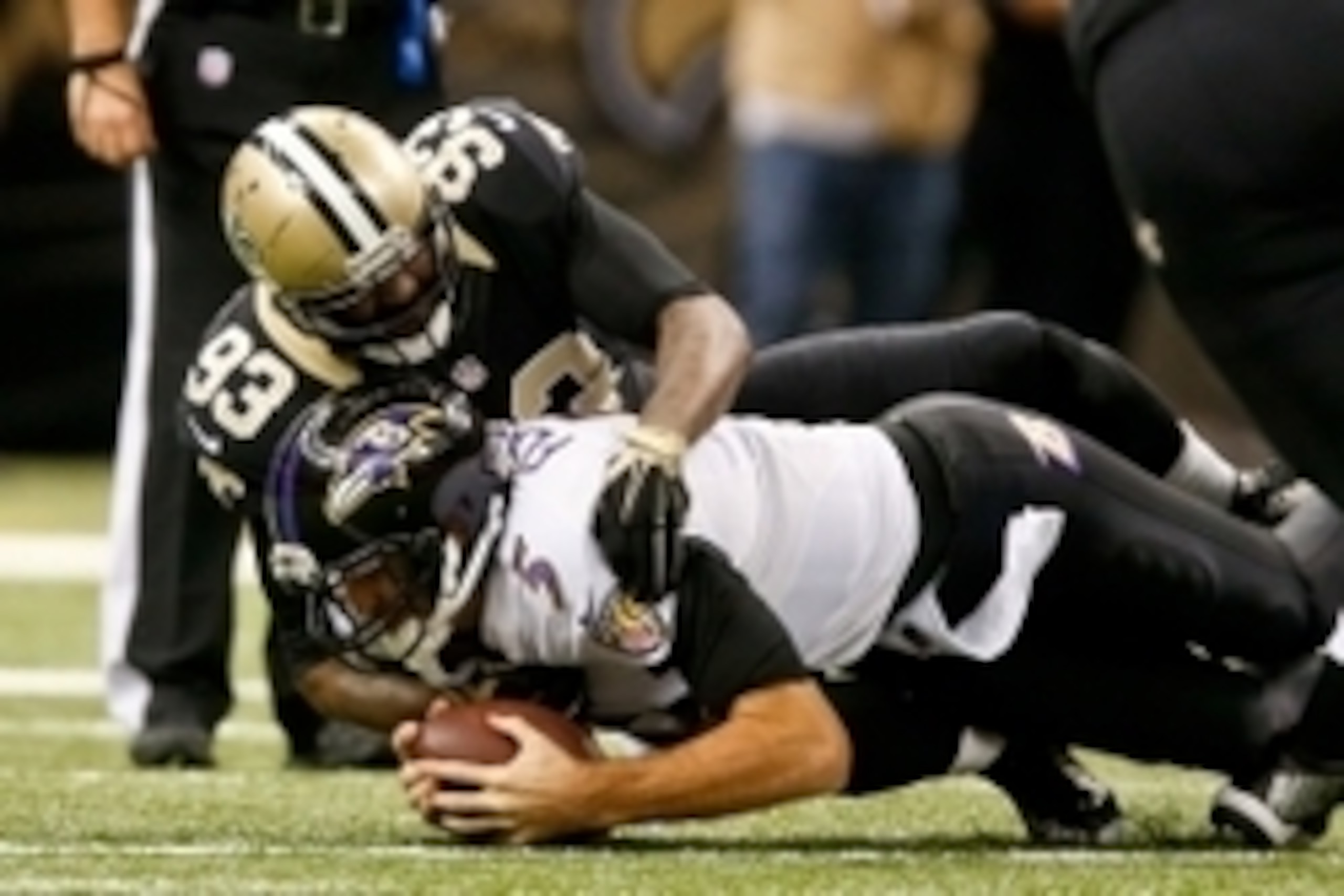 Nov 24, 2014; New Orleans, LA, USA; New Orleans Saints outside linebacker Junior Galette (93) sacks Baltimore Ravens quarterback Joe Flacco (5) during the second quarter of a game at the Mercedes-Benz Superdome. Mandatory Credit: Derick E. Hingle-USA TODA