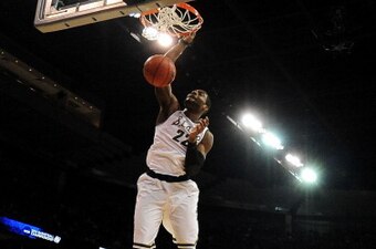 SPOKANE, WA - MARCH 22:  Branden Dawson #22 of the Michigan State Spartans dunks against the Harvard Crimson in the first half during the Third Round of the 2014 NCAA Basketball Tournament at Spokane Veterans Memorial Arena on March 22, 2014 in Spokane, W