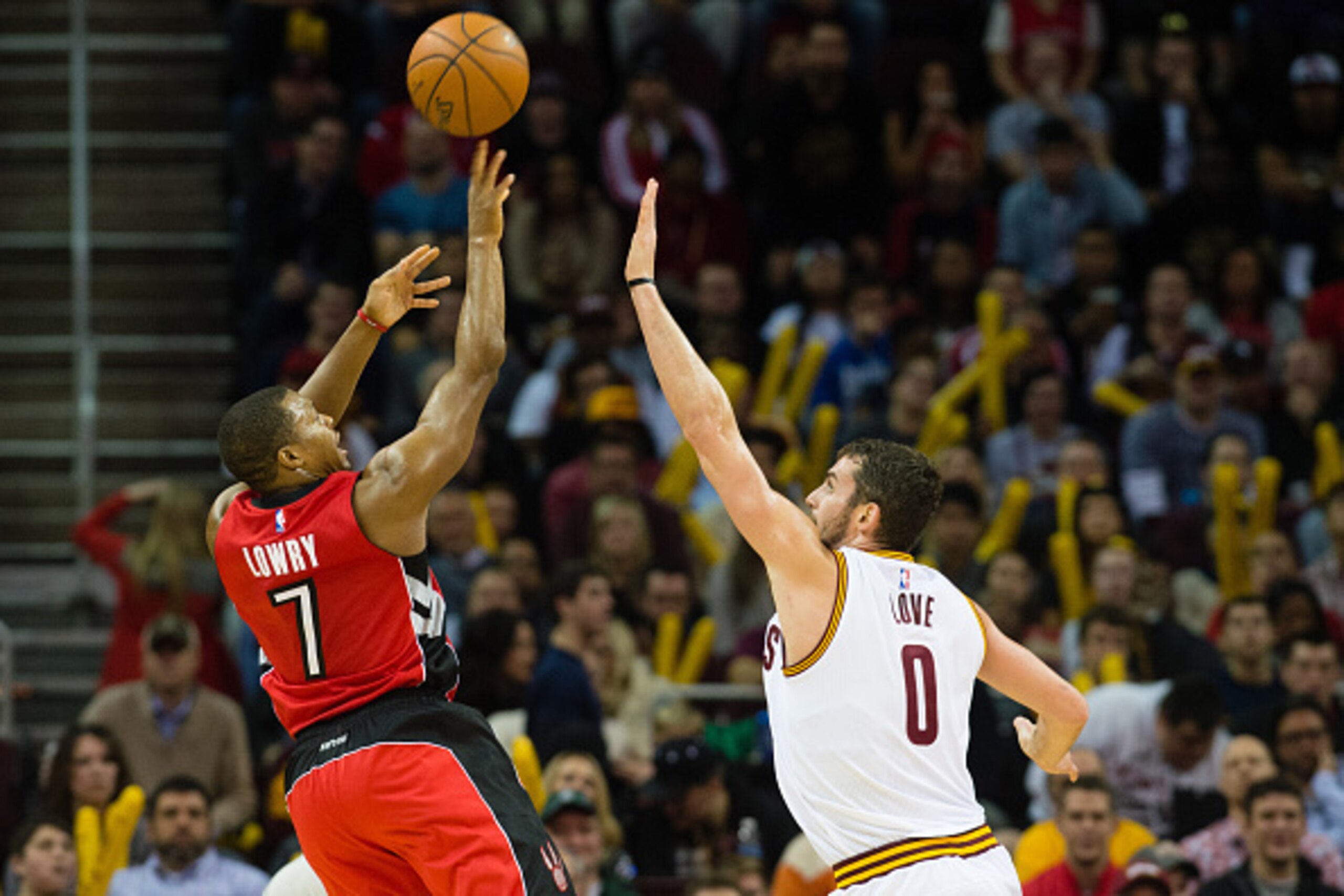 CLEVELAND, OH - NOVEMBER 22: Kyle Lowry #7 of the Toronto Raptors shoots over Kevin Love #0 of the Cleveland Cavaliers during the second half at Quicken Loans Arena on November 22, 2014 in Cleveland, Ohio. The Raptors defeated the Cavaliers 110-93. NOTE T