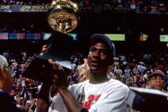 SALT LAKE CITY - JUNE 14:  Michael Jordan of the Chicago Bulls poses with his NBA Finals MVP trophy after winning the 1998 NBA Championship after defeating the Utah Jazz in Game Six of the 1998 NBA Finals against the Chicago Bulls at the Delta Center on J