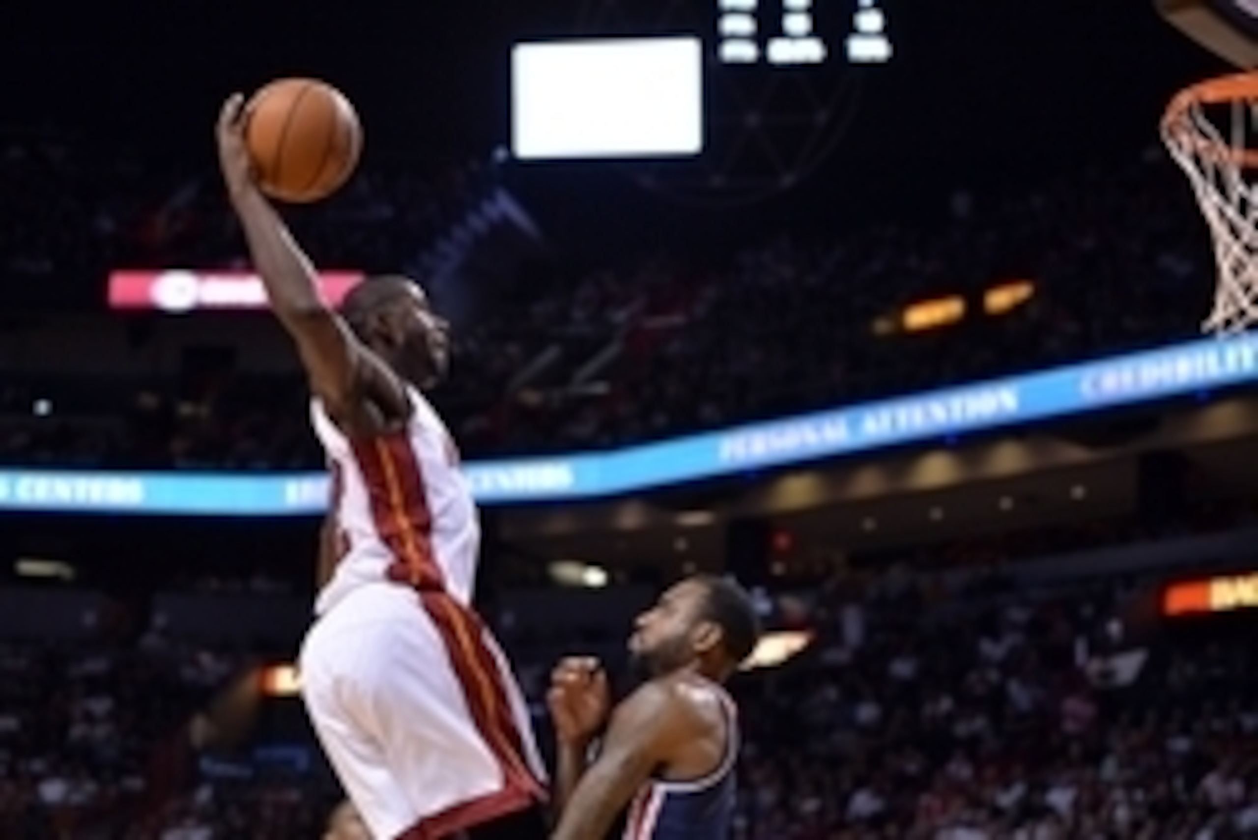 Oct 29, 2014; Miami, FL, USA; Miami Heat forward James Ennis (32) dunks over Washington Wizards forward Rasual Butler (8) during the second half at American Airlines Arena. Miami won 107-95.  Mandatory Credit: Steve Mitchell-USA TODAY Sports