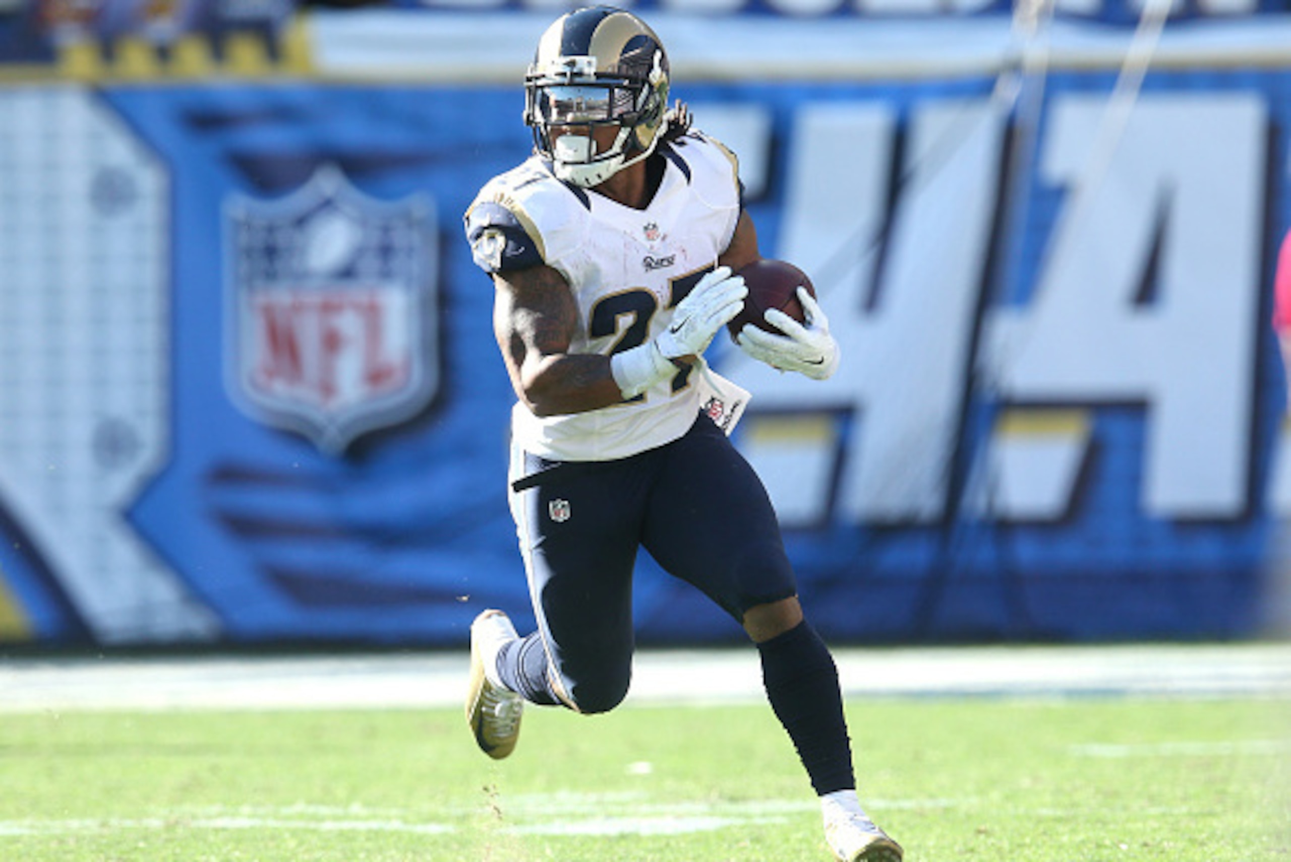 SAN DIEGO, CA - NOVEMBER 23:  Running back Tre Mason #27 of the St. Louis Rams carries the ball against the San Diego Chargers at Qualcomm Stadium on November 23, 2014 in San Diego, California.  (Photo by Stephen Dunn/Getty Images)