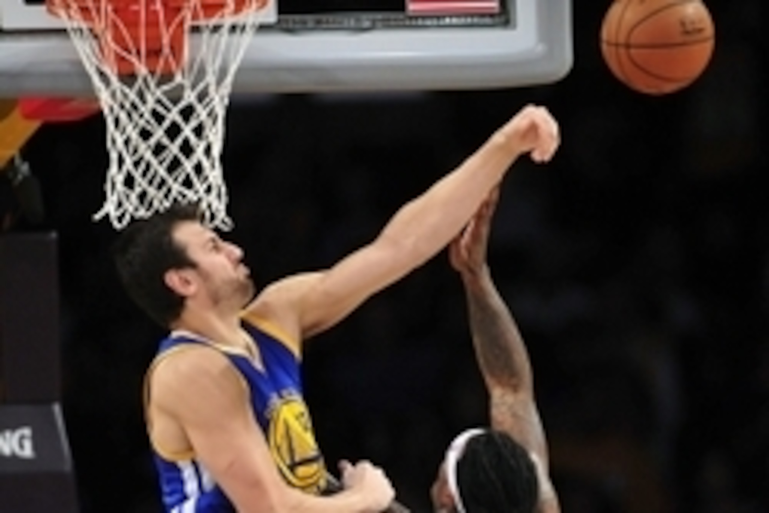 November 16, 2014; Los Angeles, CA, USA; Golden State Warriors center Andrew Bogut (12) blocks a shot against Los Angeles Lakers center Jordan Hill (27) during the first half at Staples Center. Mandatory Credit: Gary A. Vasquez-USA TODAY Sports