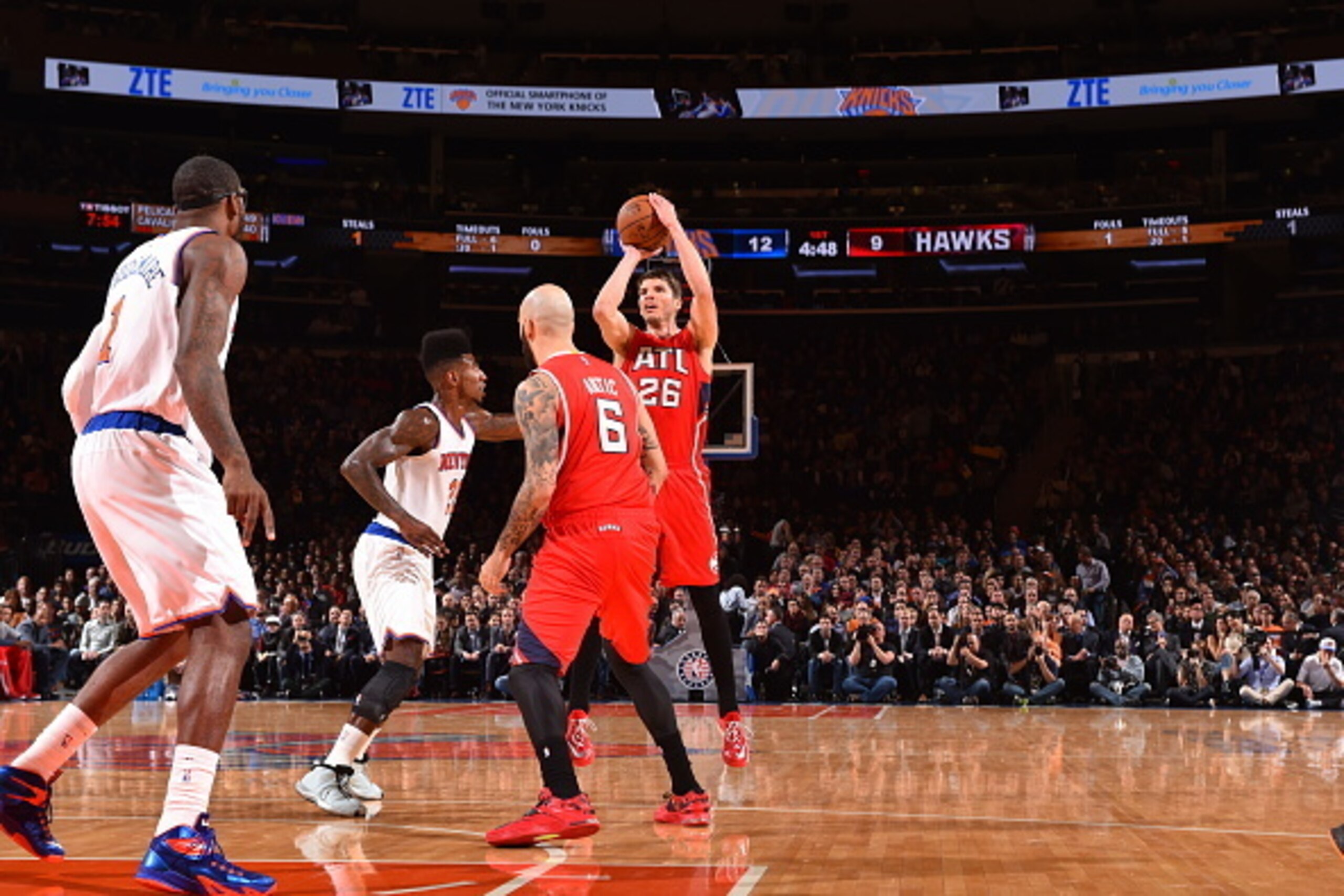 NEW YORK, NY - NOVEMBER 10:  Kyle Korver #26 of the Atlanta Hawks shoots against the New York Knicks on November 10, 2014 at Madison Square Garden in New York City.  NOTE TO USER: User expressly acknowledges and agrees that, by downloading and or using th