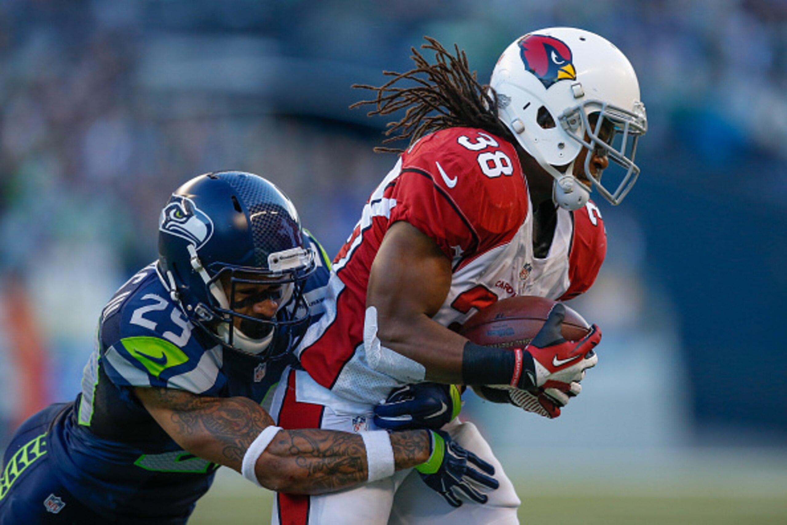 SEATTLE, WA - NOVEMBER 23: Running back Andre Ellington #38 of the Arizona Cardinals is tackled by free safety Earl Thomas #29 of the Seattle Seahawks at CenturyLink Field on November 23, 2014 in Seattle, Washington. The Seahawks defeated the Cardinals 1 SEATTLE, WA - NOVEMBER 23: Running back Andre Ellington #38 of the Arizona Cardinals is tackled by free safety Earl Thomas #29 of the Seattle Seahawks at CenturyLink Field on November 23, 2014 in Seattle, Washington. The Seahawks defeated the Cardinals 1