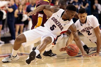 SPOKANE, WA - NOVEMBER 22:  Gary Bell Jr. #5 and Angel Nunez #2 of the Gonzaga Bulldogs scramble for a loose ball in the second half against the St. Thomas Aquinas Spartans at McCarthey Athletic Center on November 22, 2014 in Spokane, Washington.  Gonzaga