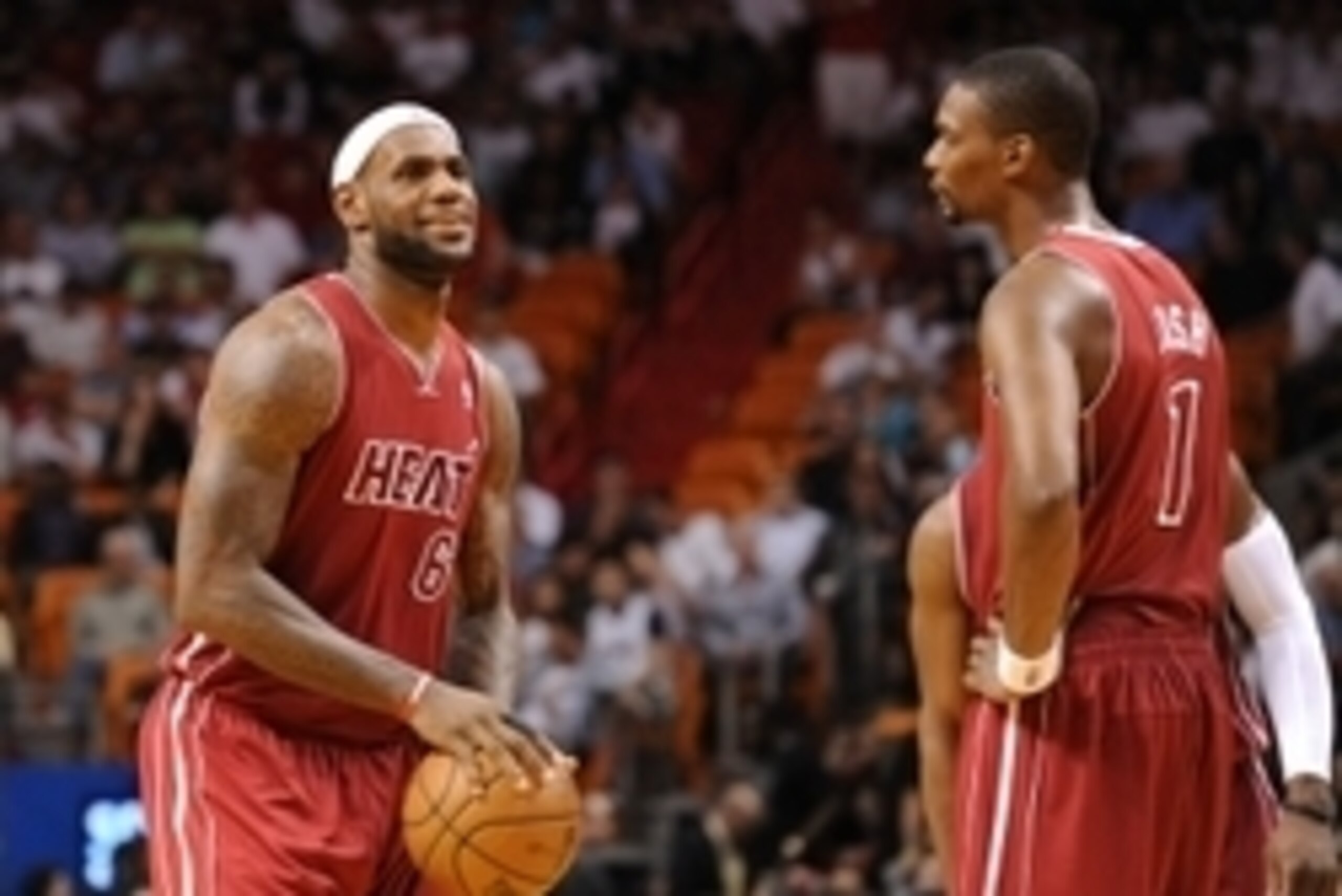 Dec 18, 2013; Miami, FL, USA; Miami Heat small forward LeBron James (left) talks with center Chris Bosh (right) during the second half against the Indiana Pacers at American Airlines Arena. Miami won 97-94. Mandatory Credit: Steve Mitchell-USA TODAY Sport