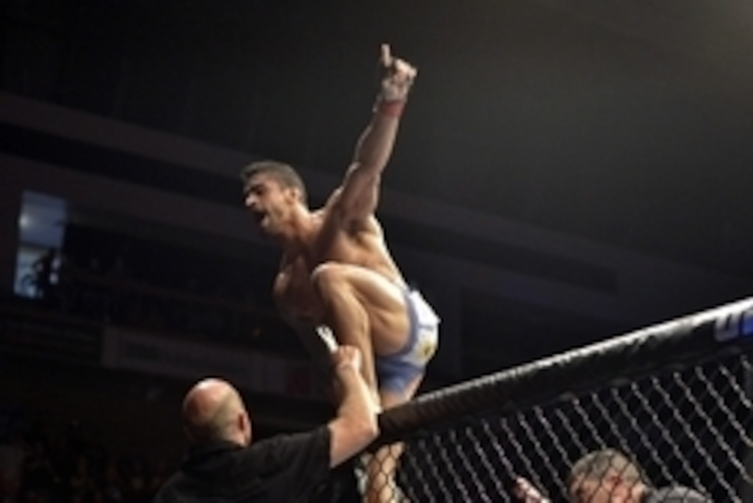 Aug 16, 2014; Bangor, ME, USA; Thiago Tavares (red gloves) celebrates the victory over Robbie Peralta (blue gloves not pictured) during a featherweight bout in UFC Fight Night 47 at Cross Insurance Center. Mandatory Credit: Gregory J. Fisher-USA TODAY Spo