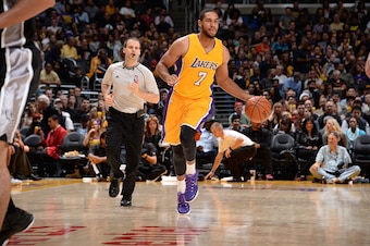 LOS ANGELES, CA - NOVEMBER 14:  Xavier Henry #7 of the Los Angeles Lakers brings the ball up court against the San Antonio Spurs on November 14, 2014 at Staples Center in Los Angeles, California. NOTE TO USER: User expressly acknowledges and agrees that, 
