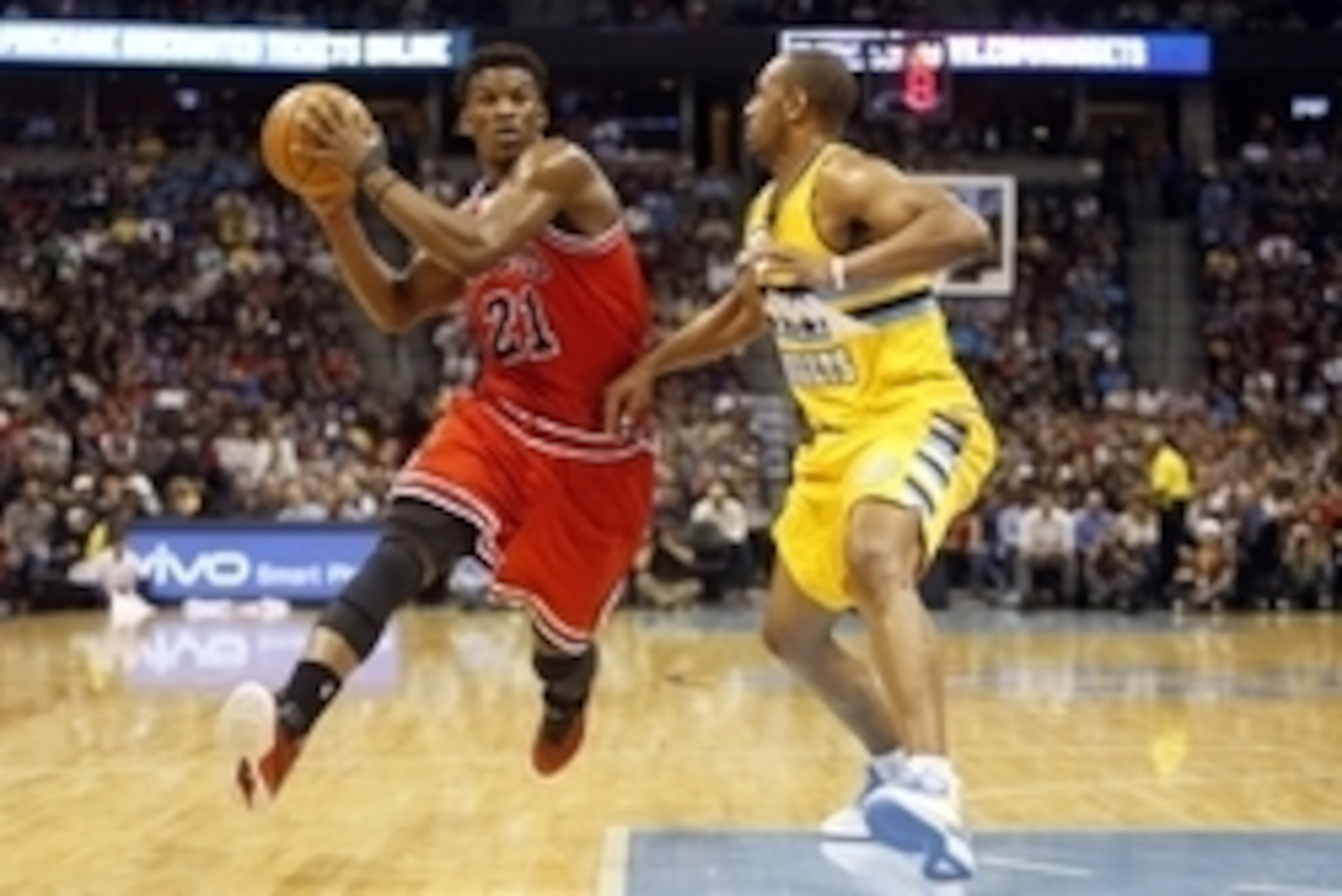 Nov 25, 2014; Denver, CO, USA; Chicago Bulls guard Jimmy Butler (21) drives to the basket against Denver Nuggets guard Arron Afflalo (10) during the second half at Pepsi Center. The Nuggets won 114-109.  Mandatory Credit: Chris Humphreys-USA TODAY Sports