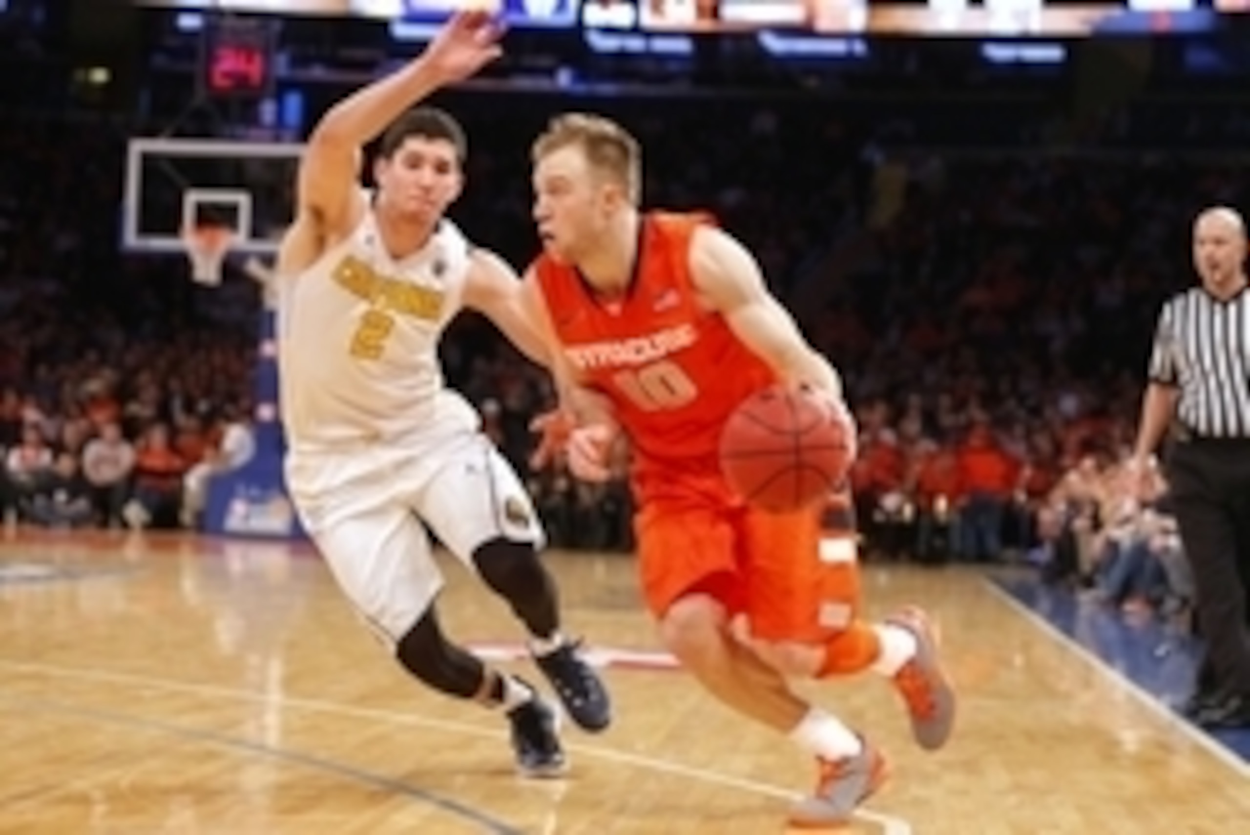 Nov 20, 2014; New York, NY, USA;  Syracuse Orange guard Trevor Cooney (10) drives to the basket against California Golden Bears guard Sam Singer (2) at Madison Square Garden. Mandatory Credit: Jim O'Connor-USA TODAY Sports