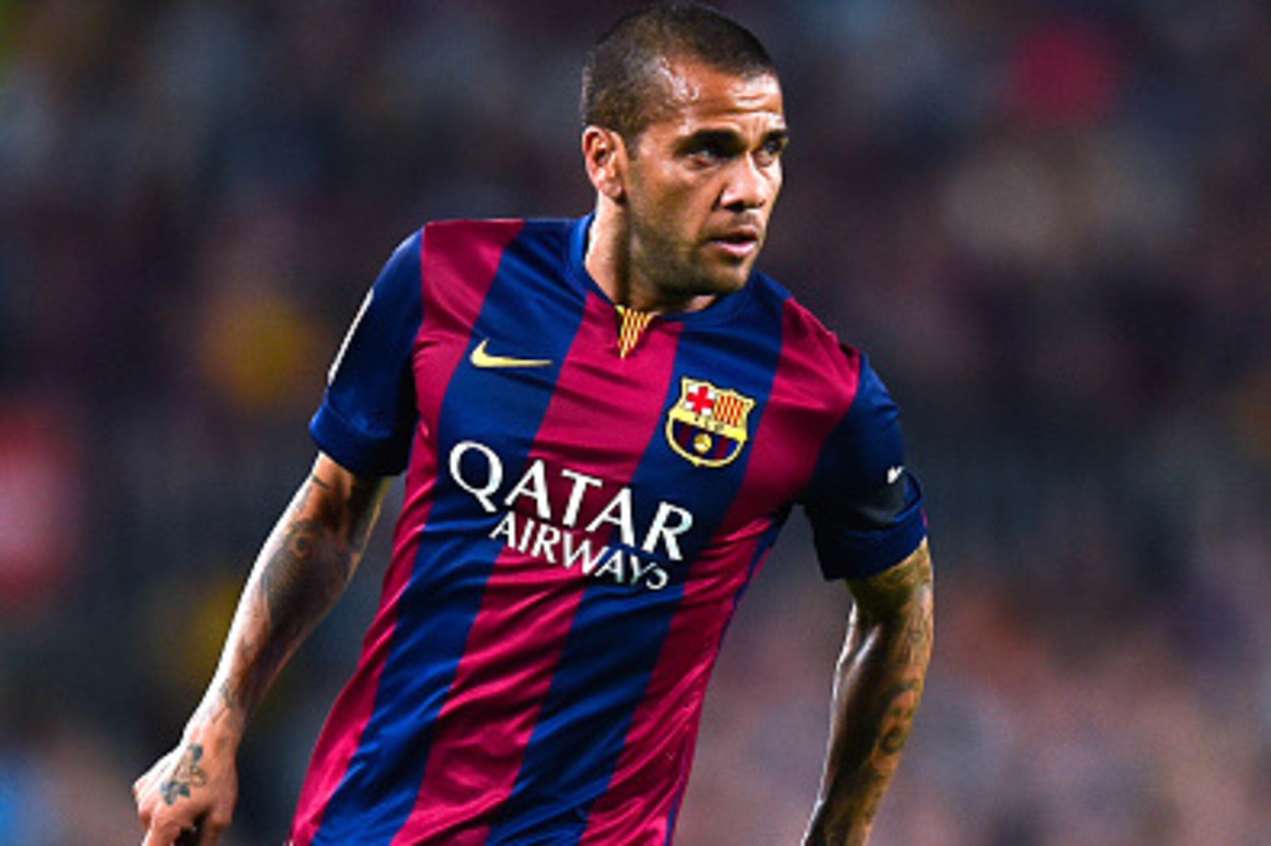 BARCELONA, SPAIN - NOVEMBER 01:  Dani Alves of FC Barcelona runs with the ball during the La Liga match between FC Barcelona and Celta de Vigo at Camp Nou on November 1, 2014 in Barcelona, Spain.  (Photo by David Ramos/Getty Images)
