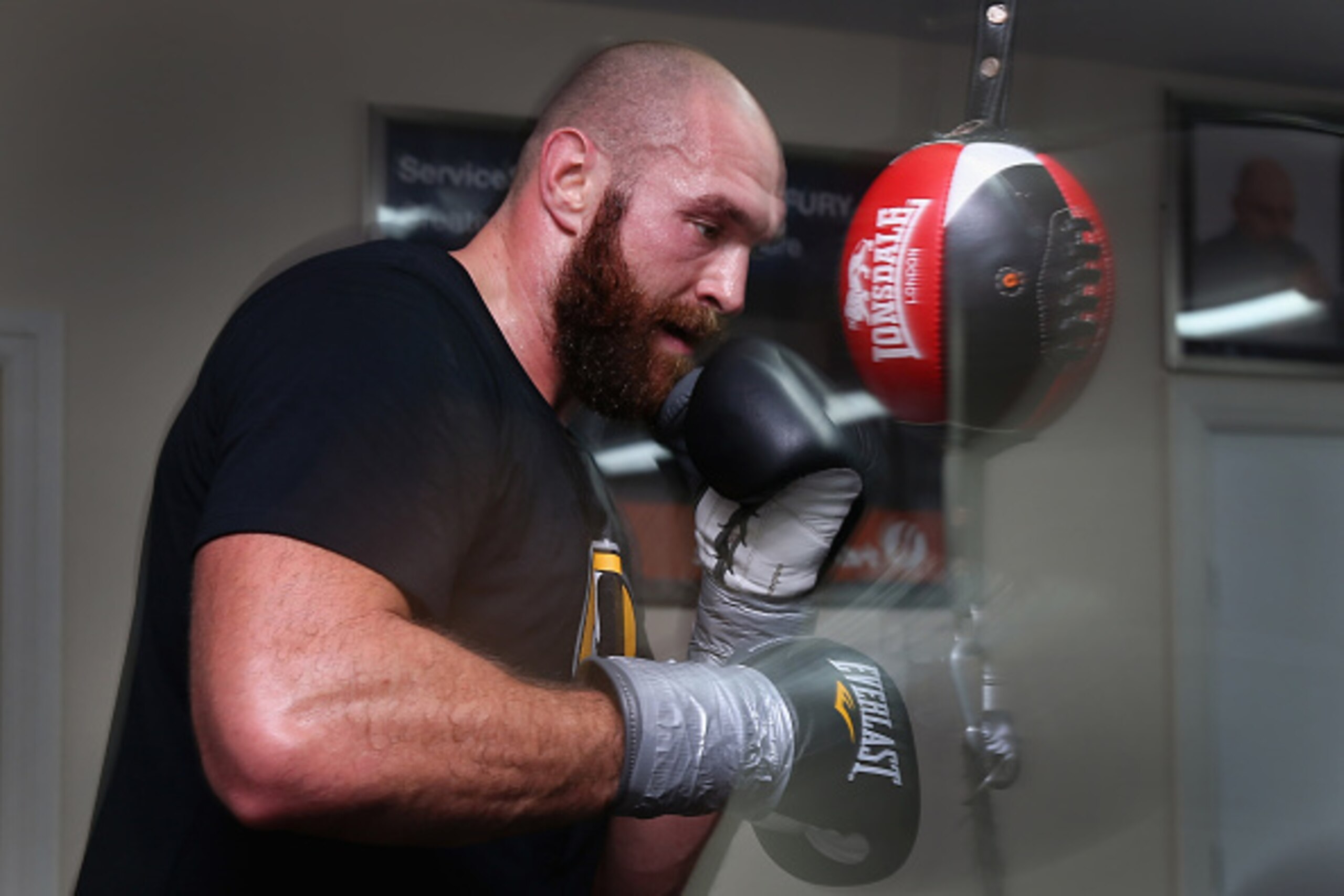 BOLTON, ENGLAND - NOVEMBER 06:  Tyson Fury works on a speedball during a training session at Team Fury Gym ahead of his fight with Dereck Chisora on November 6, 2014 in Bolton, England.  (Photo by Alex Livesey/Getty Images)