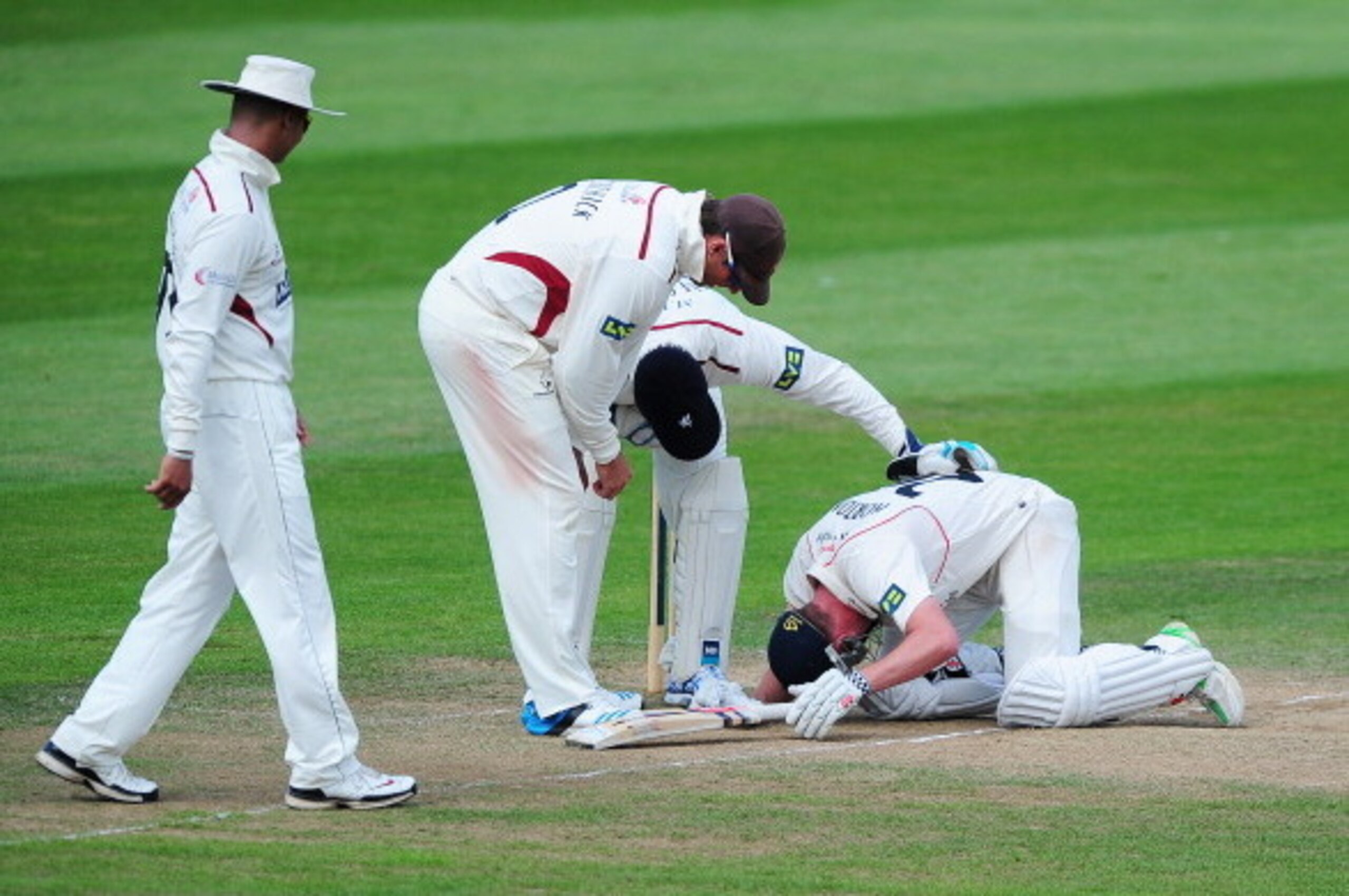 TAUNTON, ENGLAND - JULY 01: Alviro Petersen, Marcus Trescothick and Craig Kieswetter of Somerset check on Paul Horton of Lancashire after he took a ball to the helmet during day three of the LV County Championship Division One match between Somerset and TAUNTON, ENGLAND - JULY 01: Alviro Petersen, Marcus Trescothick and Craig Kieswetter of Somerset check on Paul Horton of Lancashire after he took a ball to the helmet during day three of the LV County Championship Division One match between Somerset and