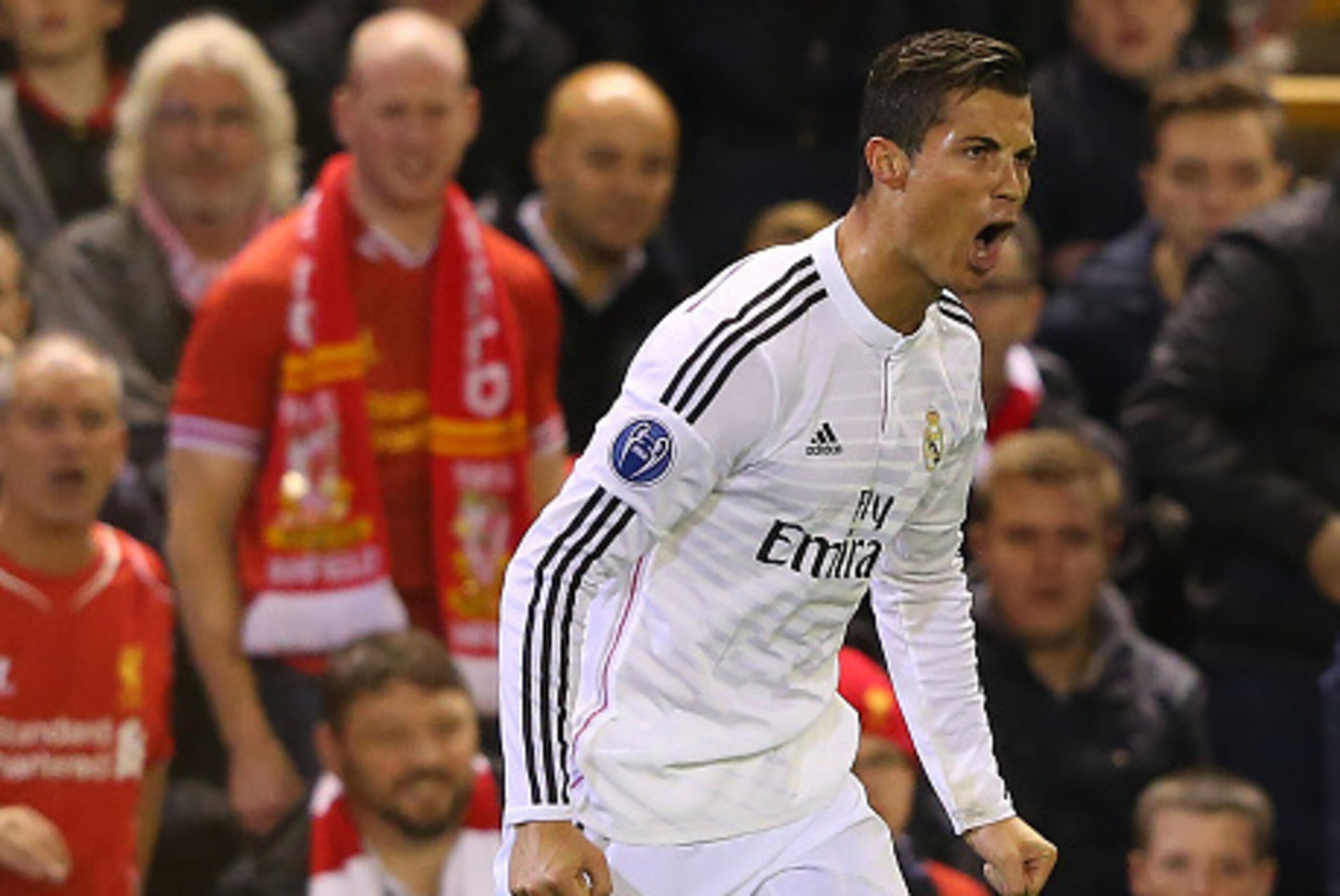 LIVERPOOL, ENGLAND - OCTOBER 22:  Cristiano Ronaldo of Real Madrid celebrates scoring the opening goal during the UEFA Champions League Group B match between Liverpool and Real Madrid CF on October 22, 2014 in Liverpool, United Kingdom.  (Photo by Alex Li