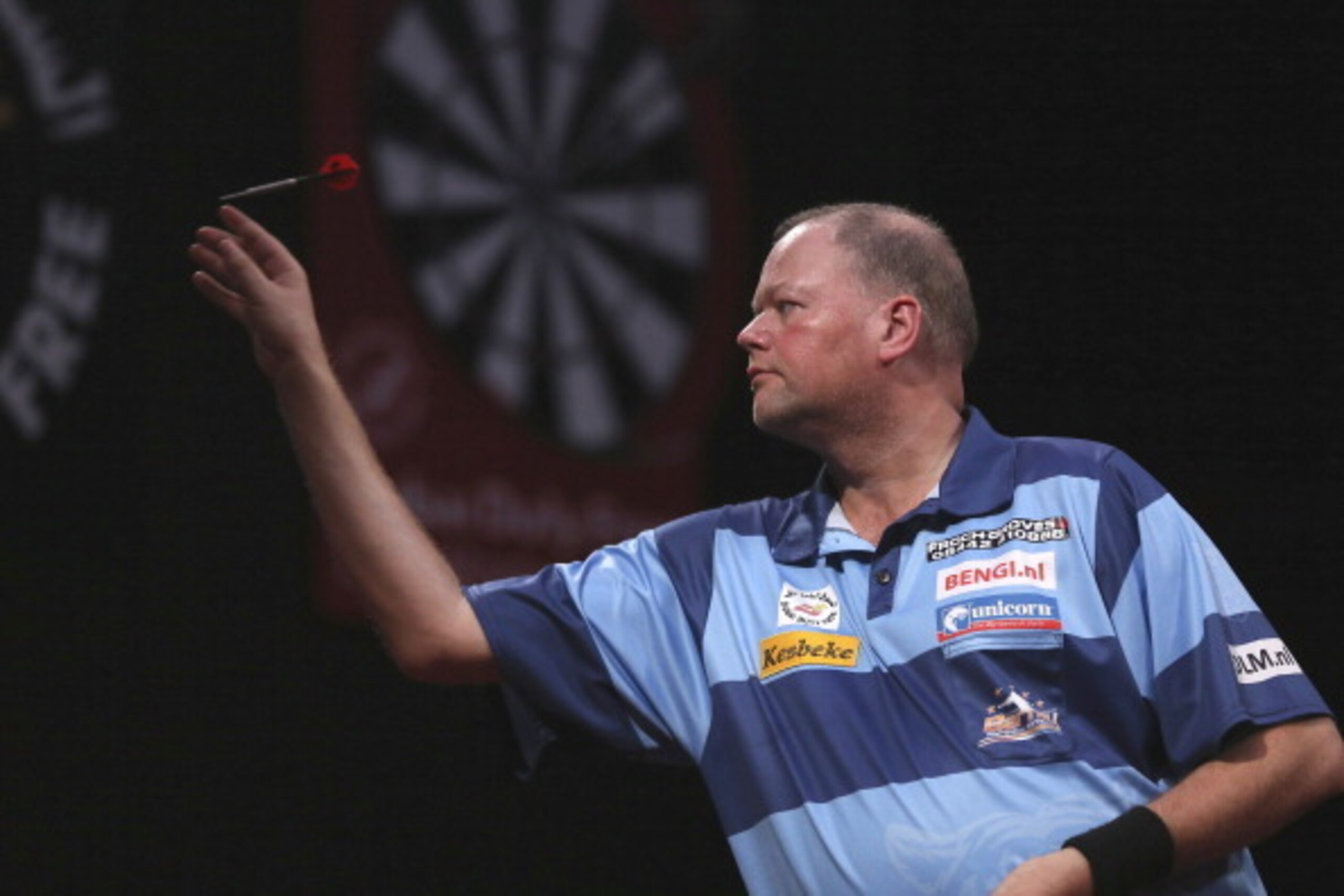 DUBAI, UNITED ARAB EMIRATES - MAY 29:  Raymond Van Barneveld of the Netherlands plays against Adrian Lewis of England during the 2014 Dubai Duty Free Darts Masters Quarter-Final  at Dubai Duty Free Tennis Stadium, Irish Village on May 29, 2014 in Dubai, U