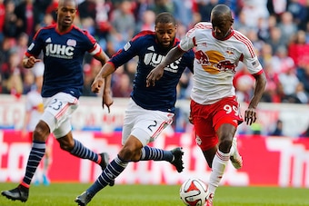 HARRISON, NJ - NOVEMBER 23:  Bradley Wright-Phillips #99 of New York Red Bulls and Andrew Farrell #2 of New England Revolution vie for the ball during the Eastern Conference Final - Leg 1 at Red Bull Arena on November 23, 2014 in Harrison, New Jersey. Rev