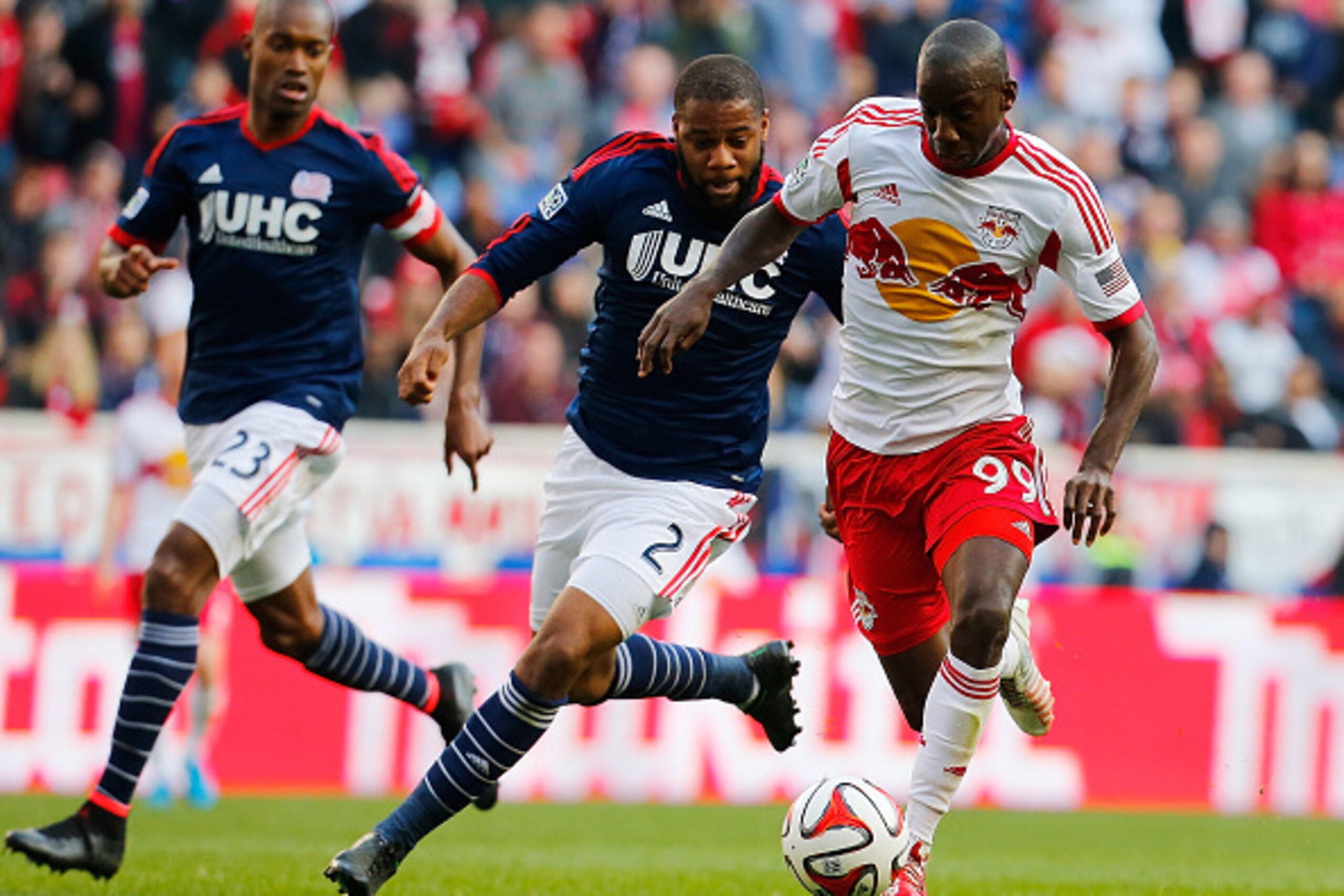 HARRISON, NJ - NOVEMBER 23:  Bradley Wright-Phillips #99 of New York Red Bulls and Andrew Farrell #2 of New England Revolution vie for the ball during the Eastern Conference Final - Leg 1 at Red Bull Arena on November 23, 2014 in Harrison, New Jersey. Rev