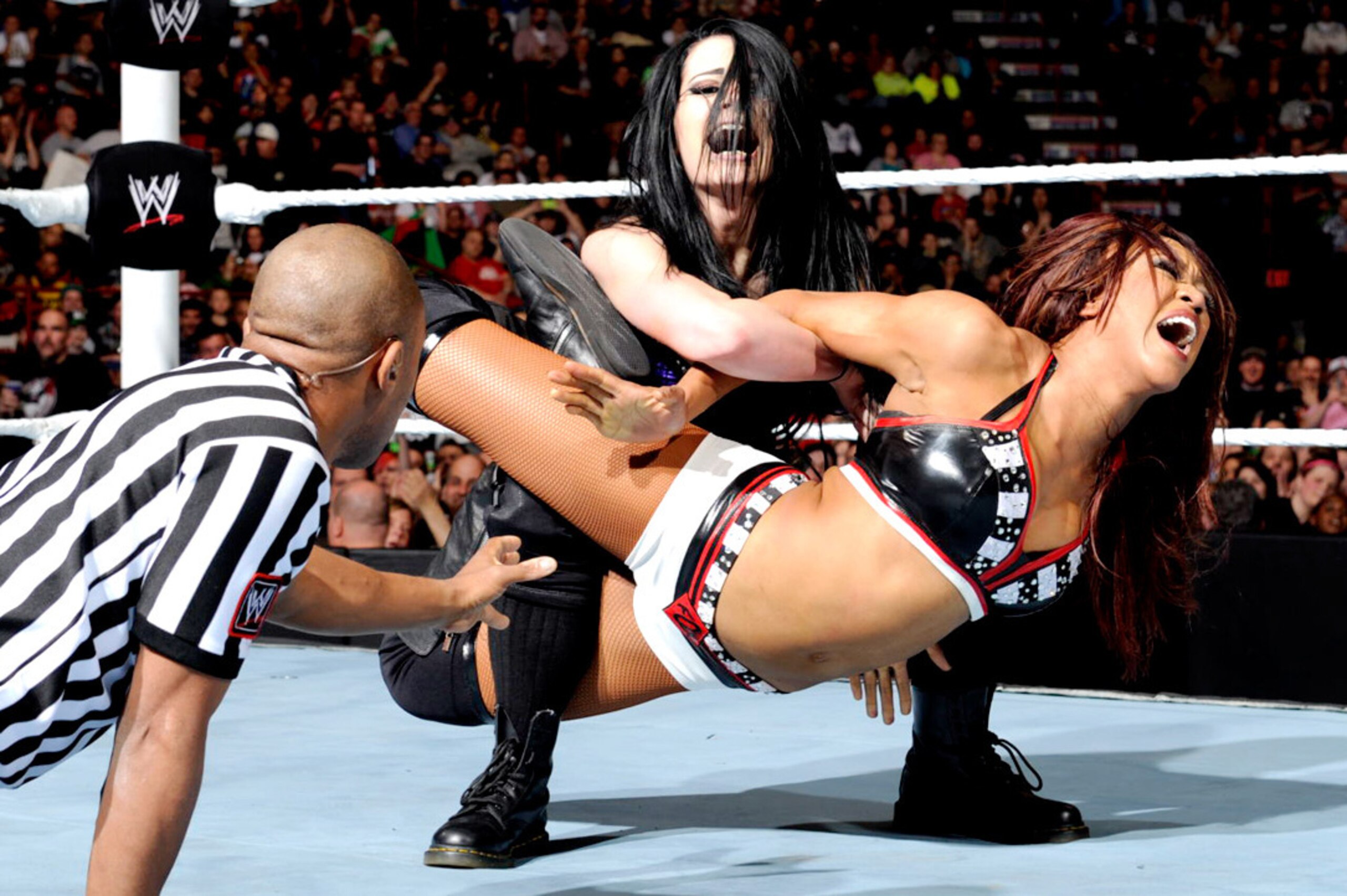 Paige puts the PTO on Alicia Fox.