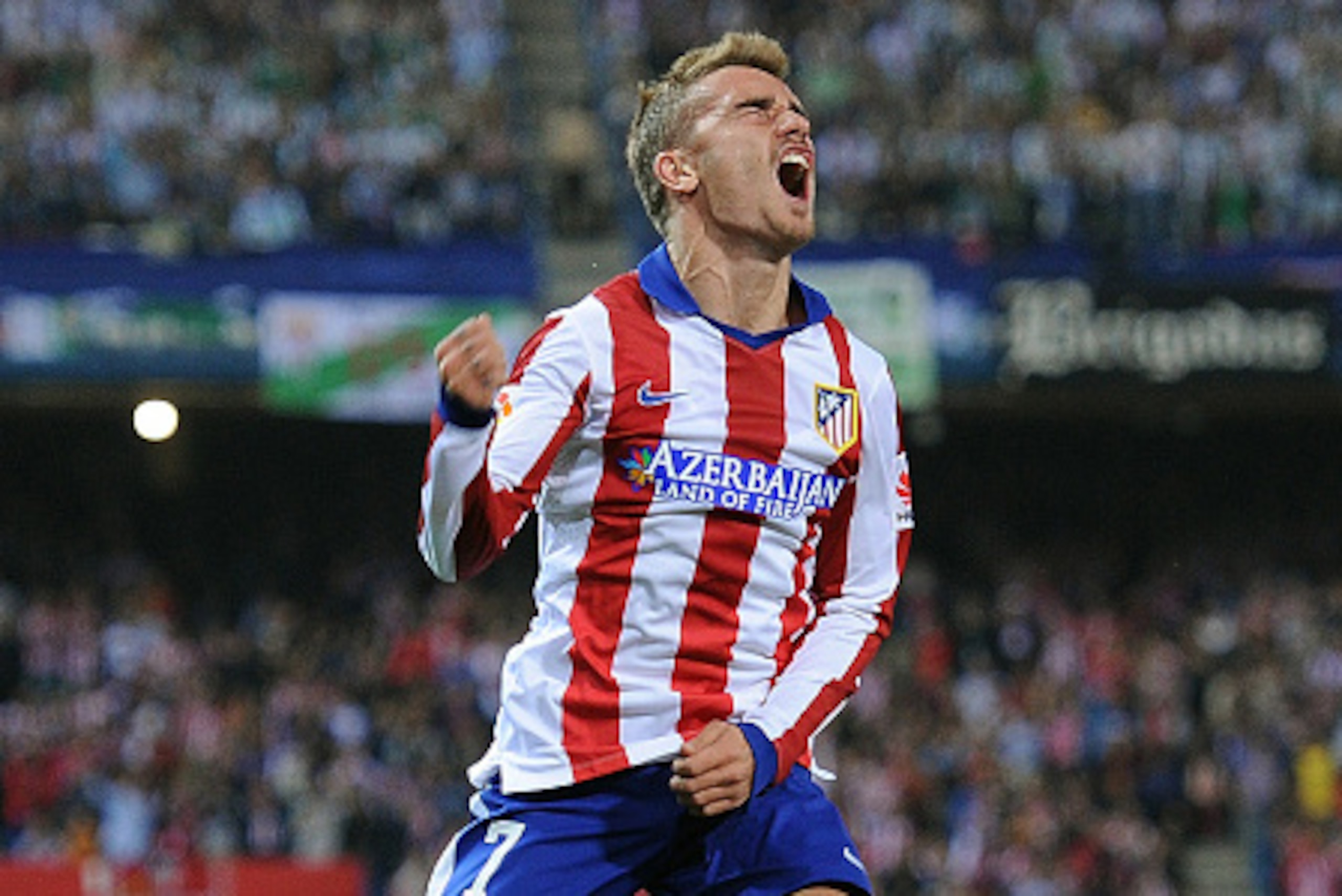 MADRID, SPAIN - NOVEMBER 01:  Antoine Griezmann of Club Atletico de Madrid celebrates after scoring his team's opening goal during the La Liga match between Club Atletico de Madrid and Cordoba CF at Vicente Calderon Stadium on November 1, 2014 in Madrid, 