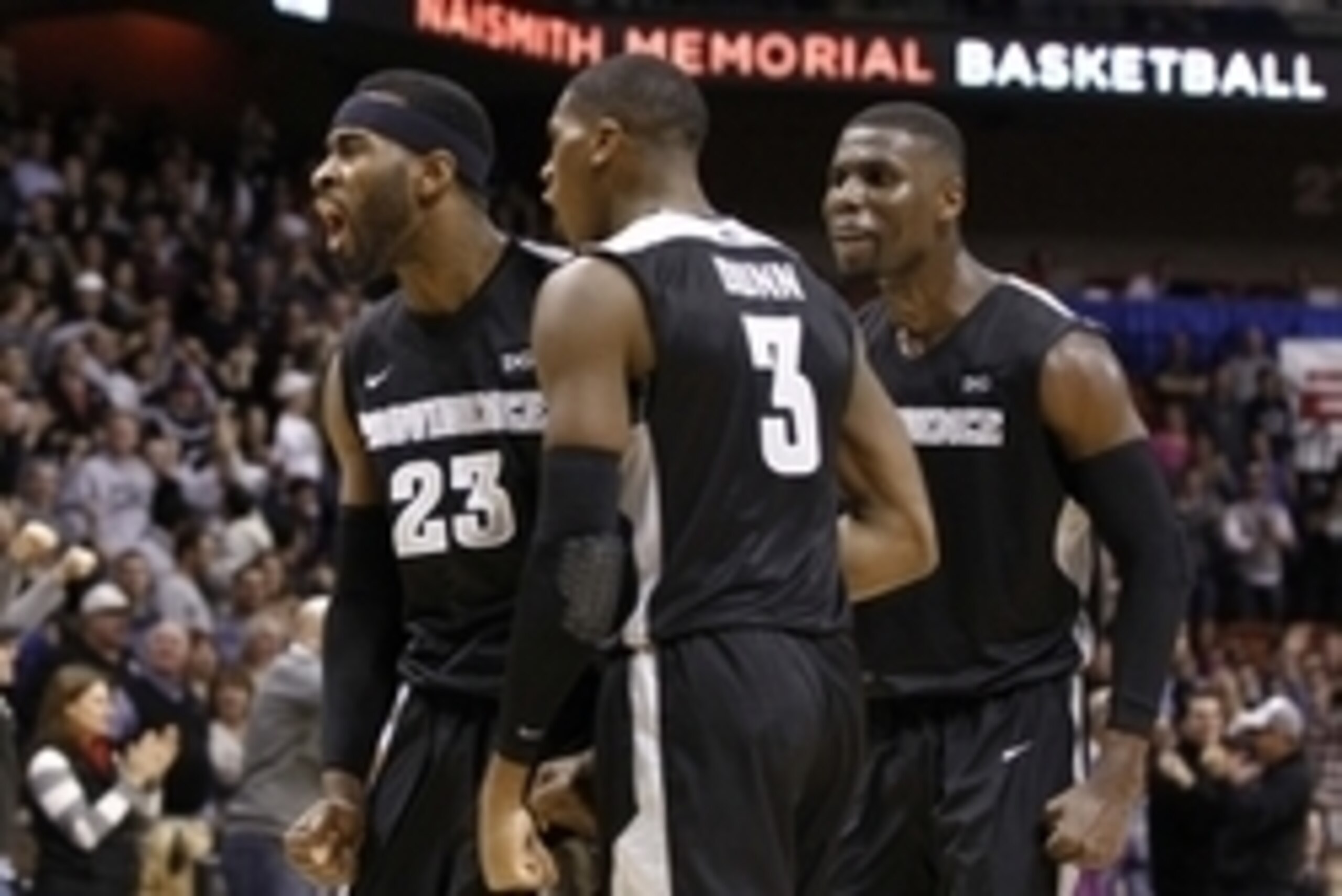 Nov 23, 2014; Uncasville, CT, USA; Providence Friars forward LaDontae Henton (23), guard Kris Dunn (3) and forward Ben Bentil (0) celebrate against the Notre Dame Fighting Irish during the second half at Mohegan Sun Arena. Mandatory Credit: Mark L. Baer-U