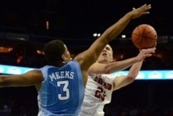Nov 22, 2014; Charlotte, NC, USA; Davidson Wildcats forward Peyton Aldridge (23) shoots over North Carolina Tar Heels forward Kennedy Meeks (3) during the first half at Time Warner Cable Arena. Mandatory Credit:  Rob Kinnan-USA Today.