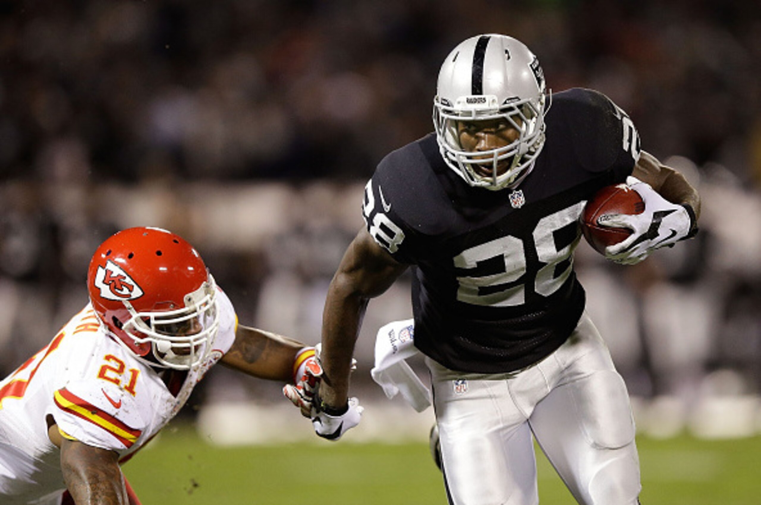 OAKLAND, CA - NOVEMBER 20:  Latavius Murray #28 of the Oakland Raiders fights off Sean Smith #21 of the Kansas City Chiefs as he runs the ball during the game at O.co Coliseum on November 20, 2014 in Oakland, California.  (Photo by Ezra Shaw/Getty Images)