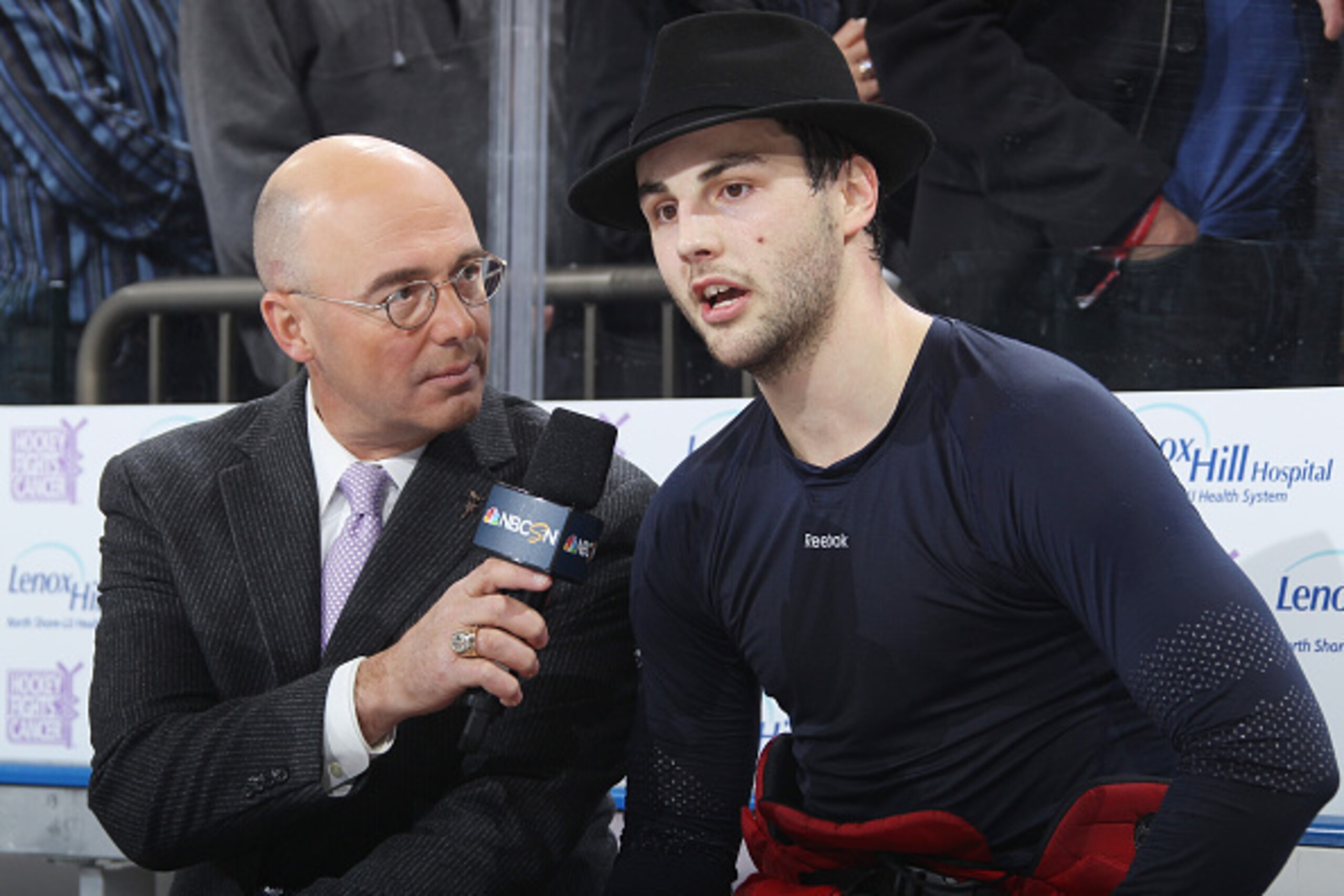 NEW YORK, NY - NOVEMBER 05: Derick Brassard #16 of the New York Rangers speaks with Pierre McGuire after scoring the game winning goal in overtime to defeat the Detroit Red Wings 4-3 at Madison Square Garden on November 5, 2014 in New York City. (Photo b NEW YORK, NY - NOVEMBER 05: Derick Brassard #16 of the New York Rangers speaks with Pierre McGuire after scoring the game winning goal in overtime to defeat the Detroit Red Wings 4-3 at Madison Square Garden on November 5, 2014 in New York City. (Photo b