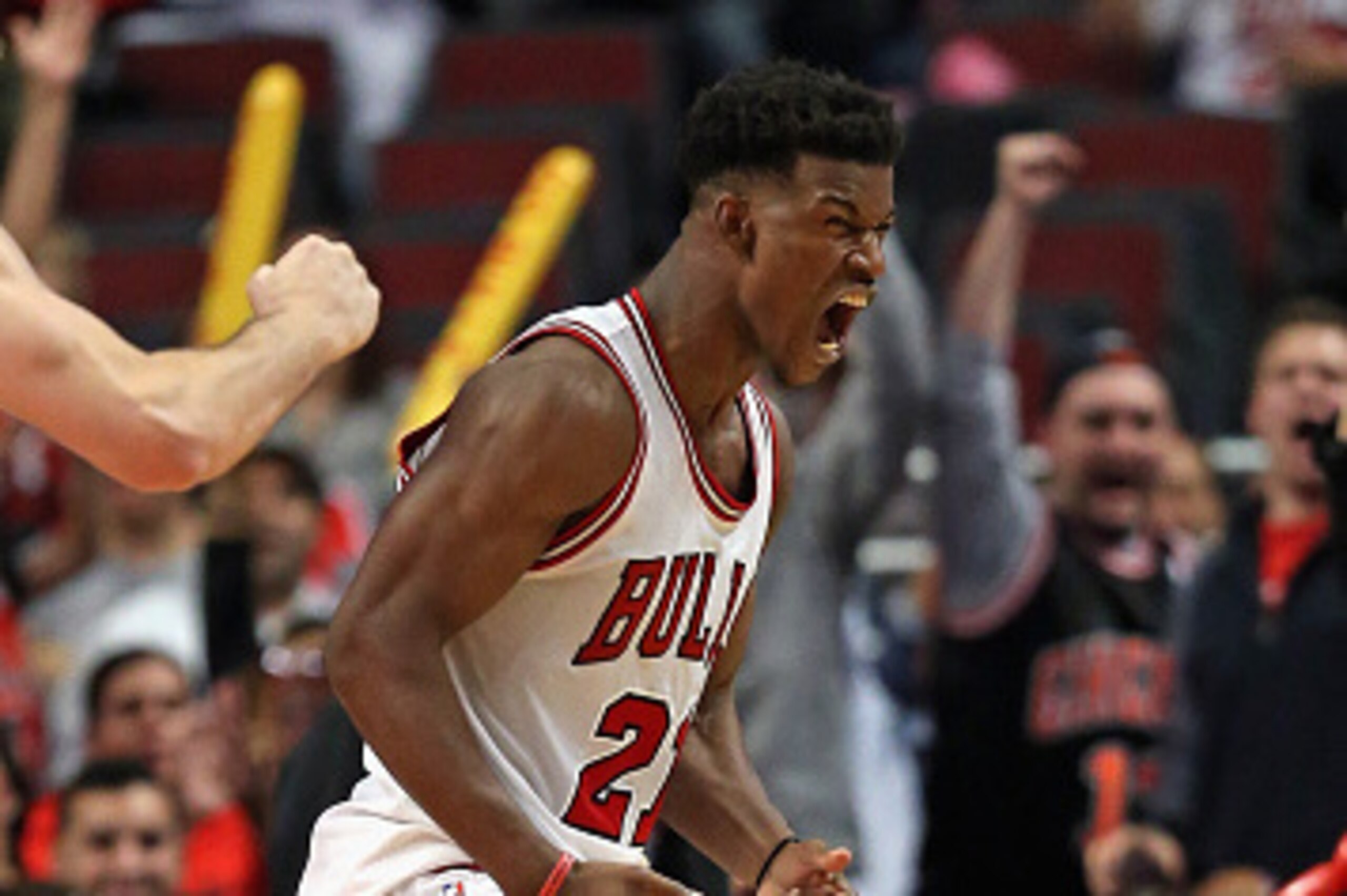 CHICAGO, IL - OCTOBER 16: Jimmy Butler #21 of the Chicago Bulls celebrates a three-point play against the Atlanra Hawks during a preseason game at the United Center on October 16, 2014 in Chicago, Illinois. The Bulls defeated the Hawks 85-84. NOTE TO USER