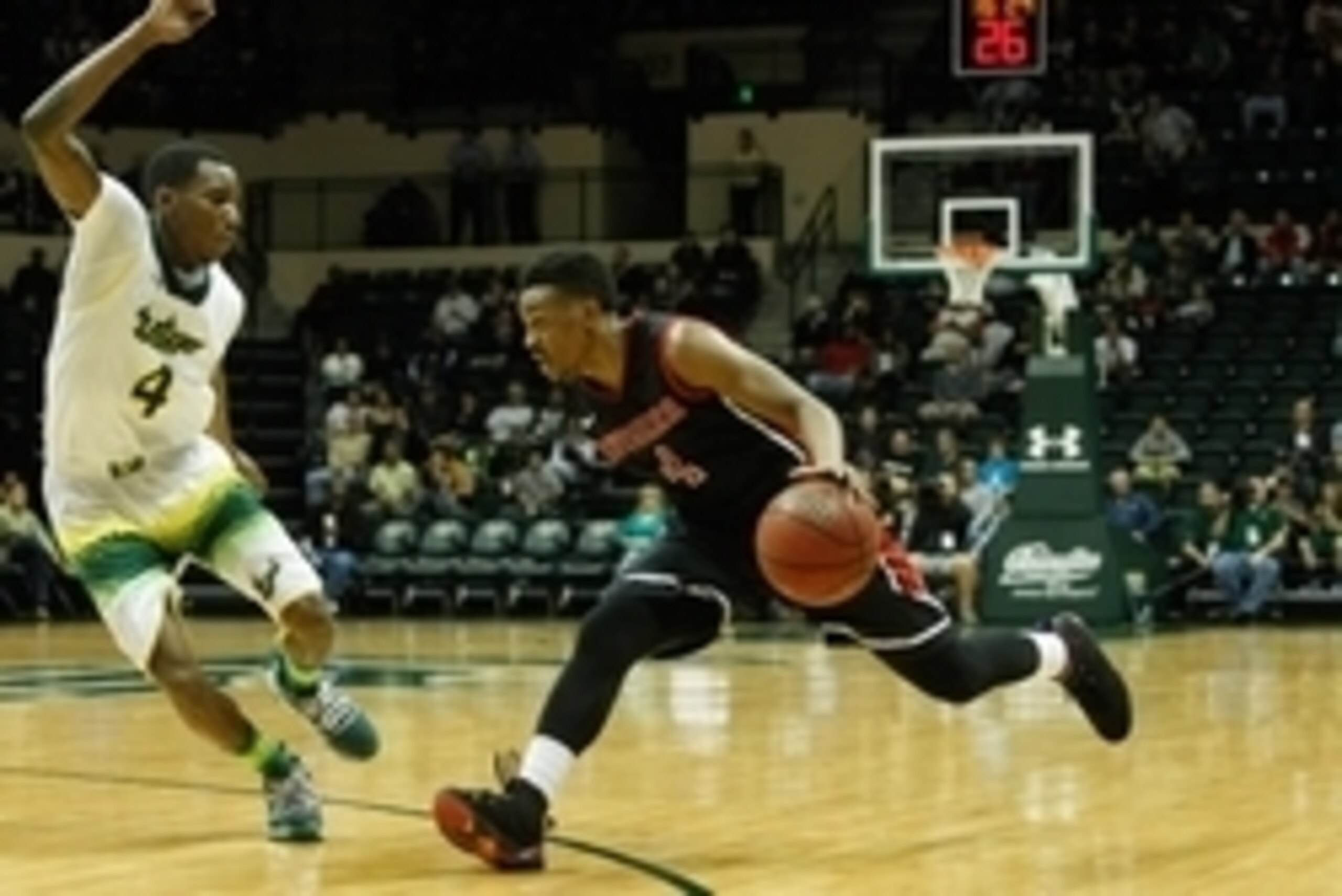 Feb 8, 2014; Tampa, FL, USA; Rutgers Scarlet Knights guard Myles Mack (4) drives to the basket as South Florida Bulls guard Corey Allen Jr. (4) defends during the second half at USF Sun Dome. Rutgers Scarlet Knights defeated the South Florida Bulls 79-69.